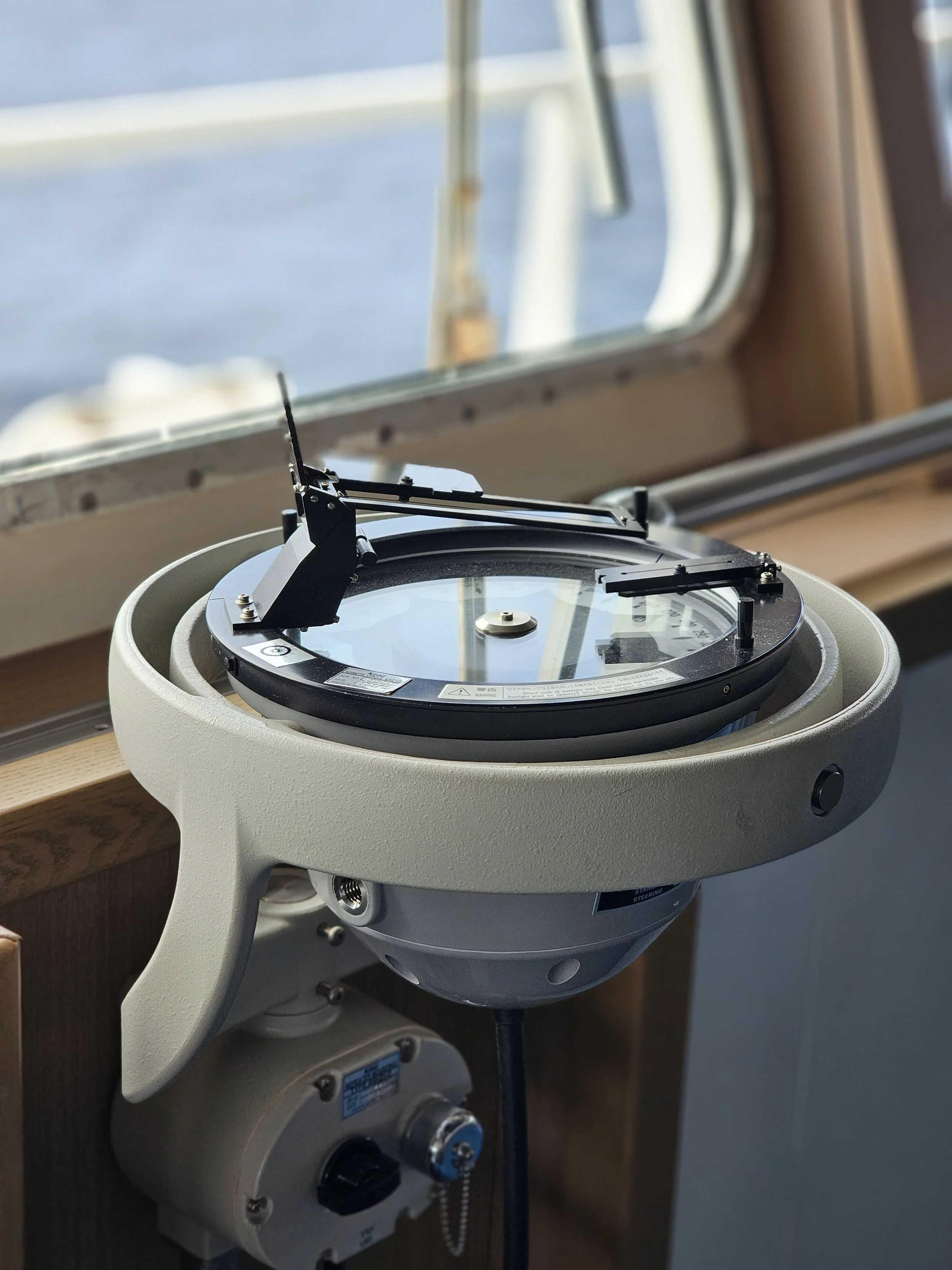 Who regulates magnetic compass requirements?