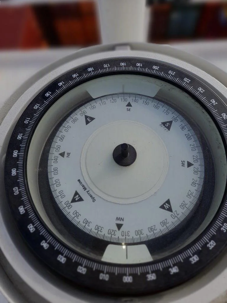 How often must a magnetic compass be adjusted?