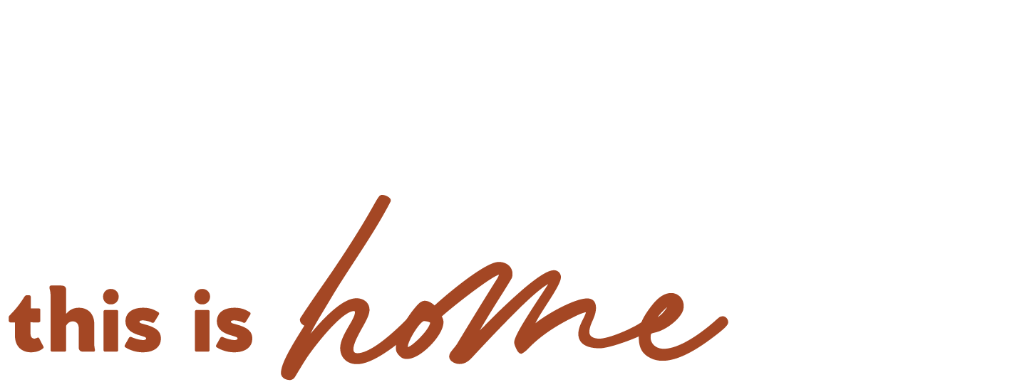 Text that reads 'this is home' in brown and cursive font.