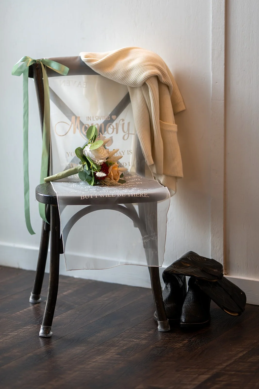 Wedding memorial display featuring Tiffany’s father’s boots and Matthew’s mother’s sweater in honor of loved ones who could not be there.