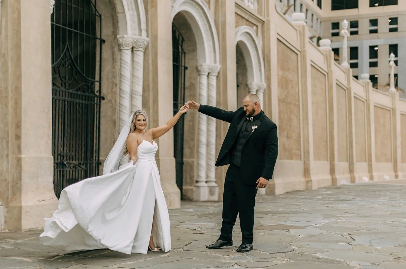 Bride and groom posing for the camera.