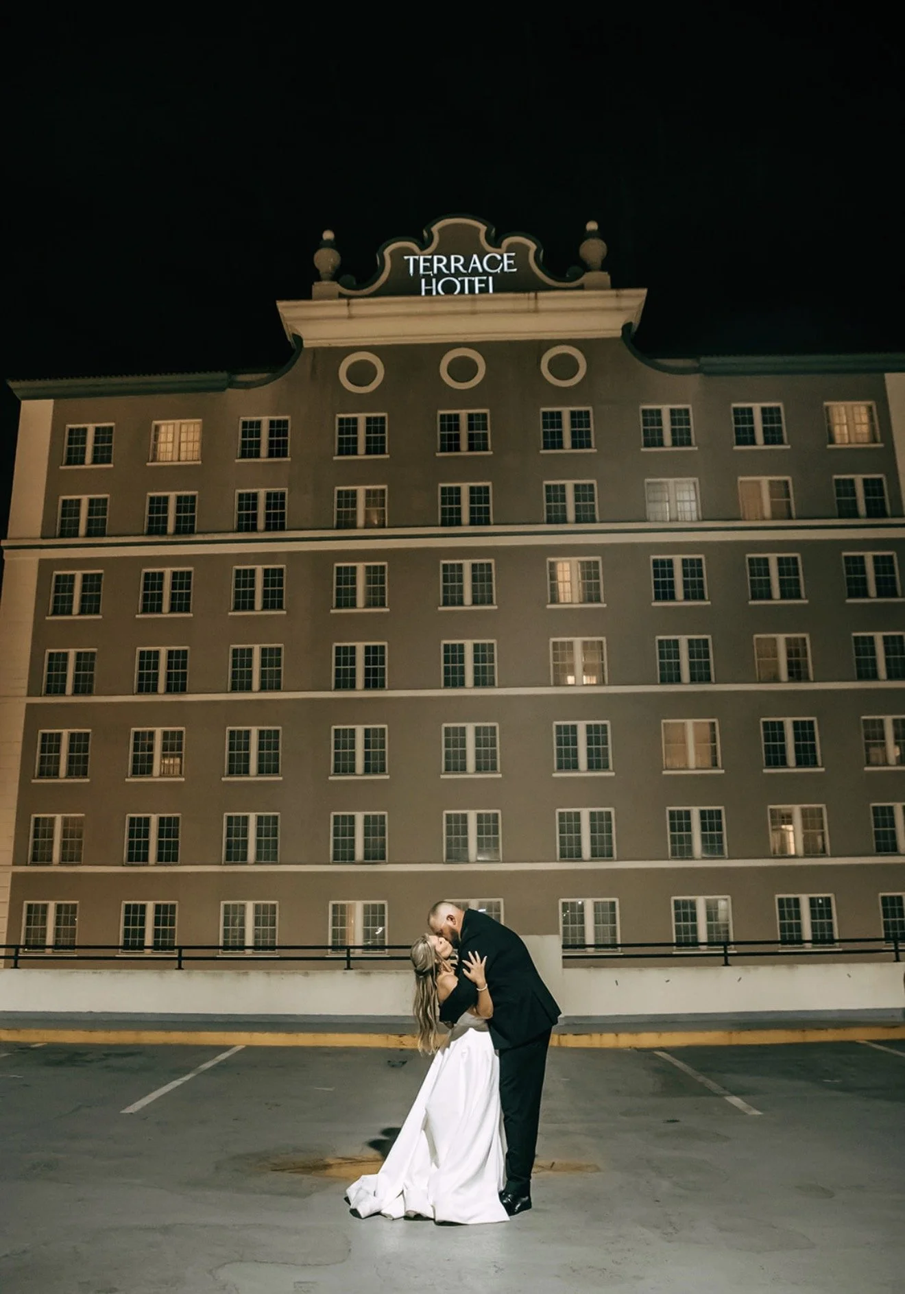 A quiet moment beneath the iconic Terrace Hotel after an unforgettable wedding celebration in the heart of Downtown Lakeland.