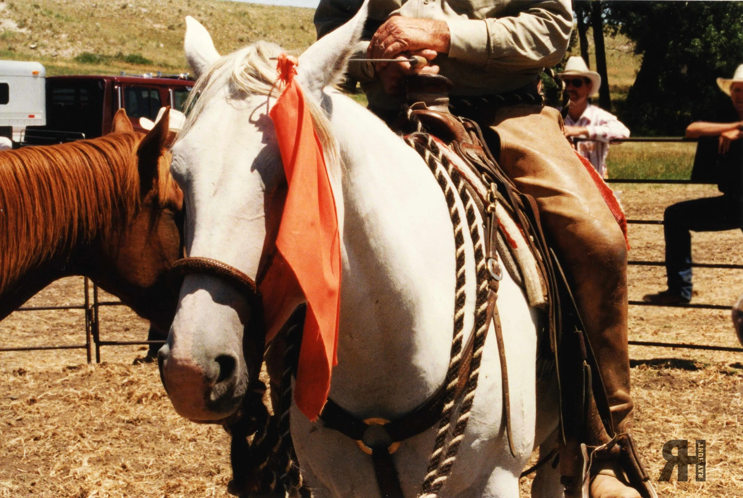 July 1996 - Ray Hunt atop a horse with his signature orange flag. 