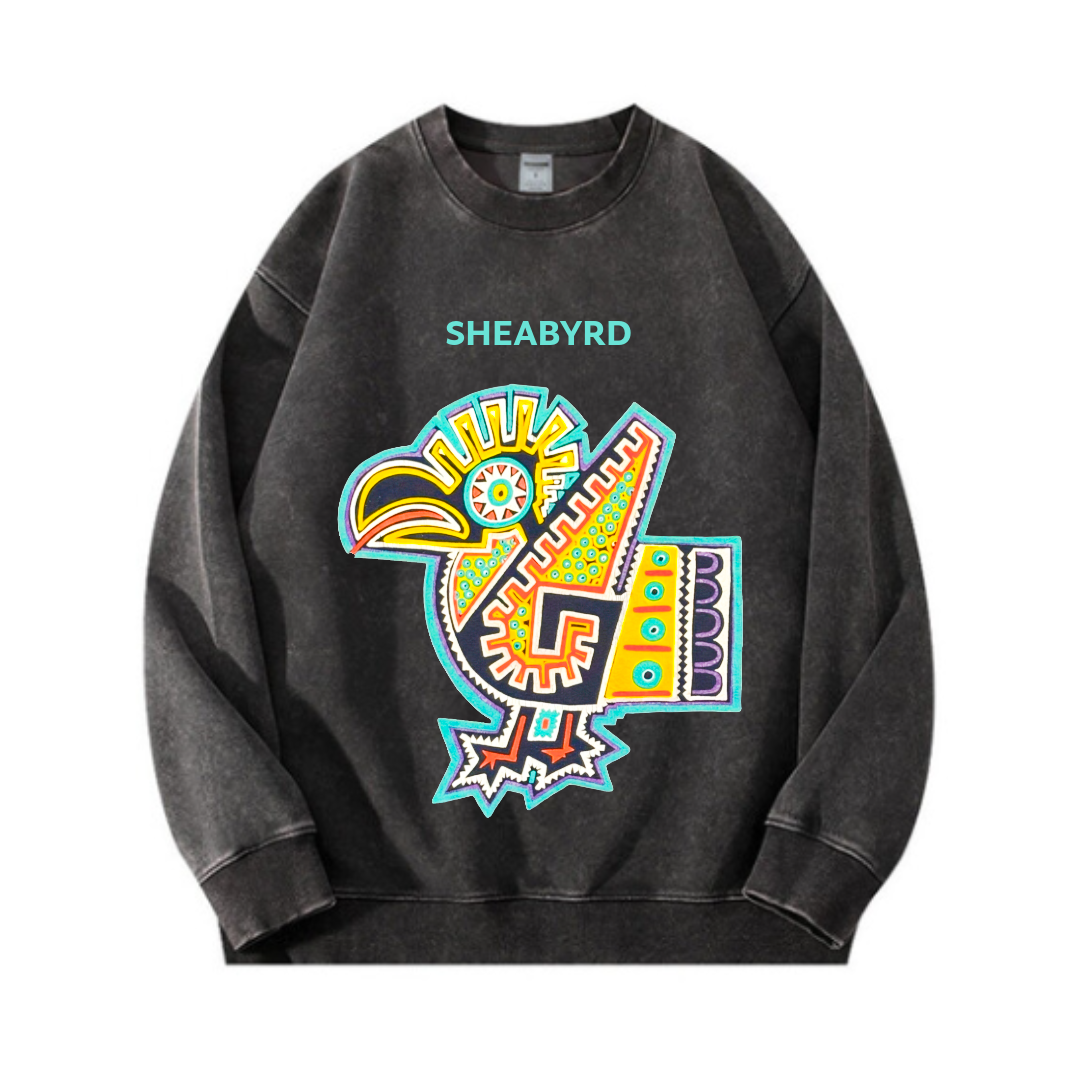 Black sweatshirt with colorful abstract design of a bird and the word SHEABYRD written above.