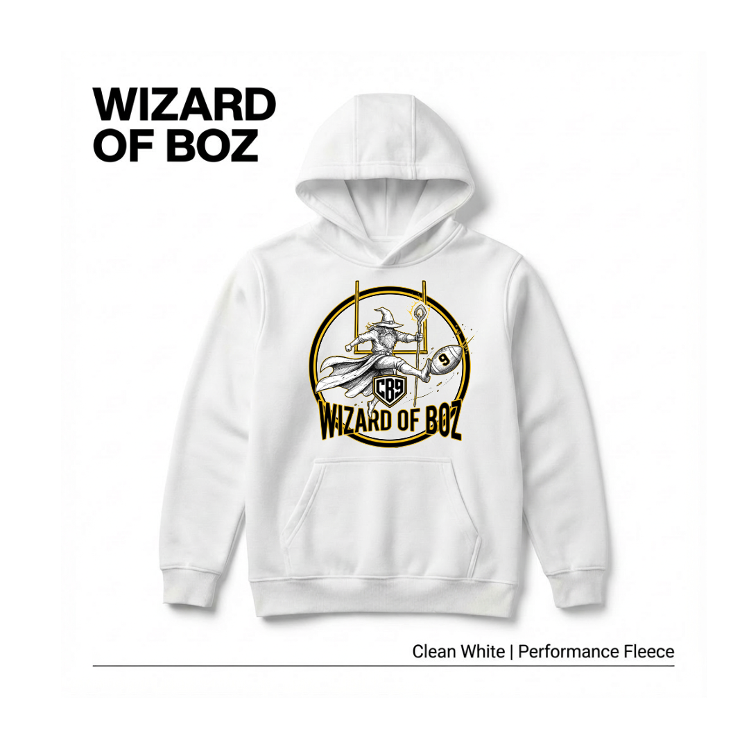 White hoodie featuring a graphic of a wizard with a wand and a broomstick, holding a football, surrounded by a circular emblem with the text "WIZARD OF BOZ" and a "CR9" shield in the center. The top left corner has the text "WIZARD OF BOZ" in bold black letters. The bottom right text reads "Clean White | Performance Fleece."