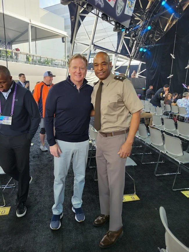 Lt. Gen. Kevin Vereen joins NFL Commissioner Roger Goodell after administering the oath of enlistment to recruits during the 2022 NFL Draft.