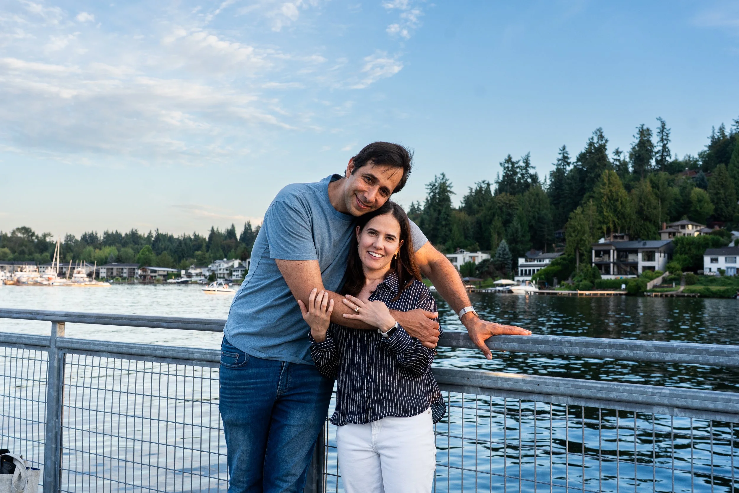 A candid portrait of parents during a Mercer Island family photography session, captured in soft evening light along the waterfront.