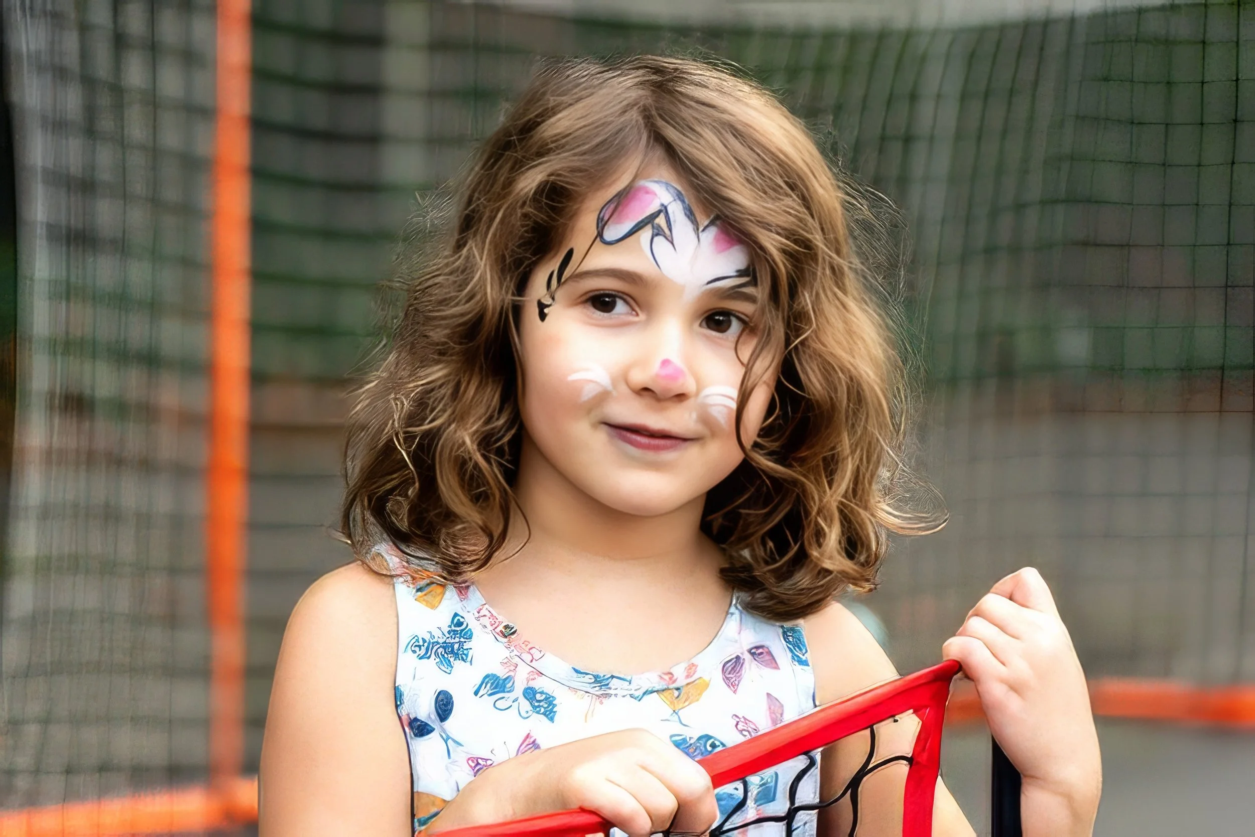 girl-face-paint-tennis-net-portrait-rey-trey-photography.jpeg