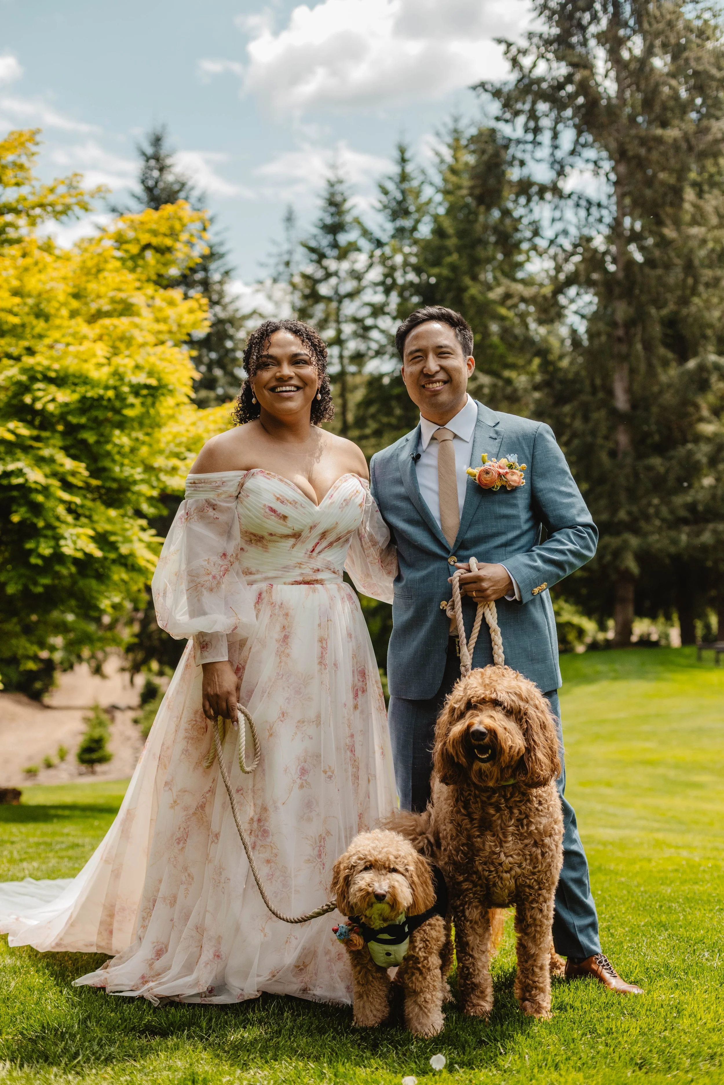 A bride and groom with a dog