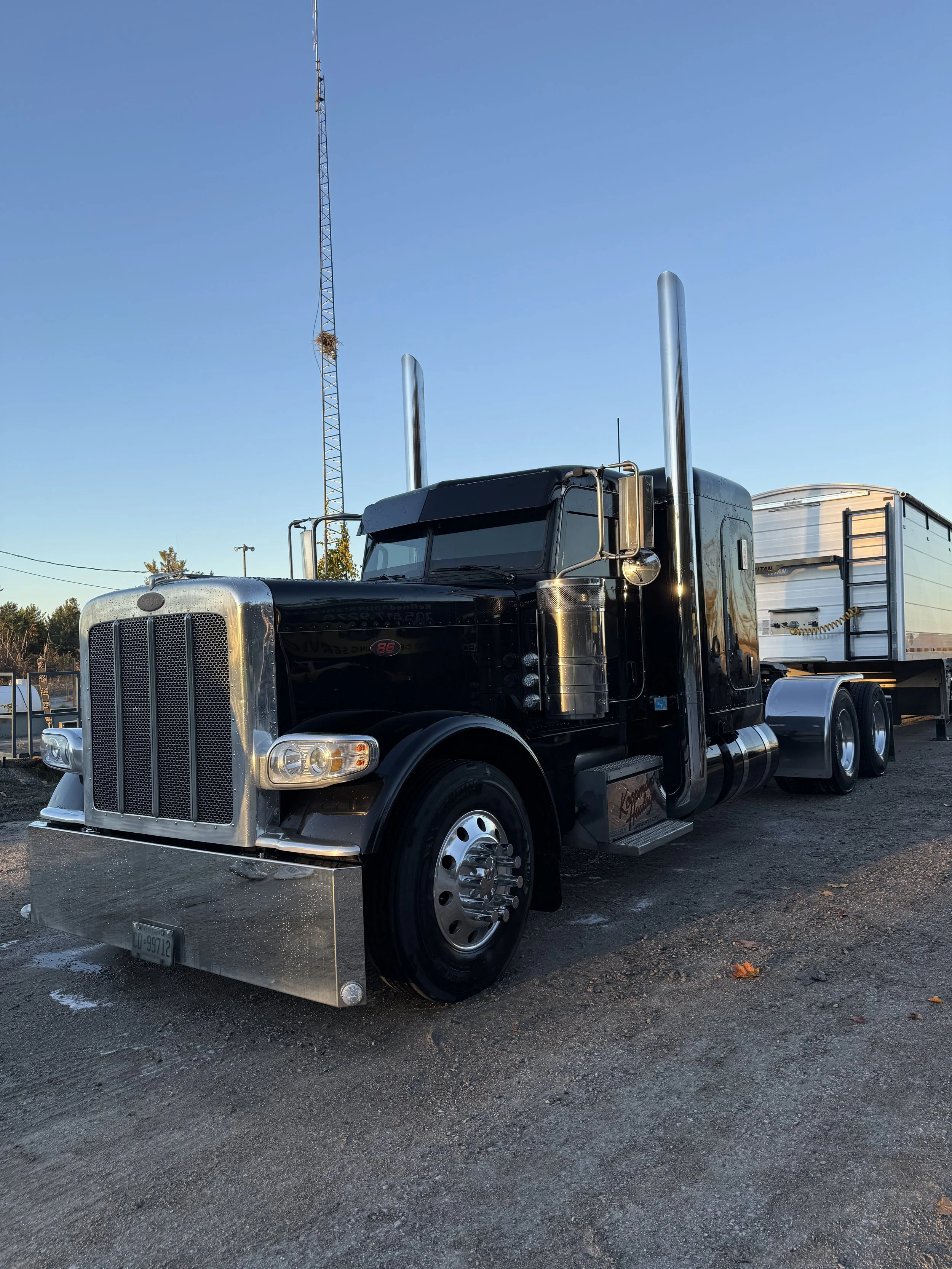 Black Peterbilt truck, getting washed