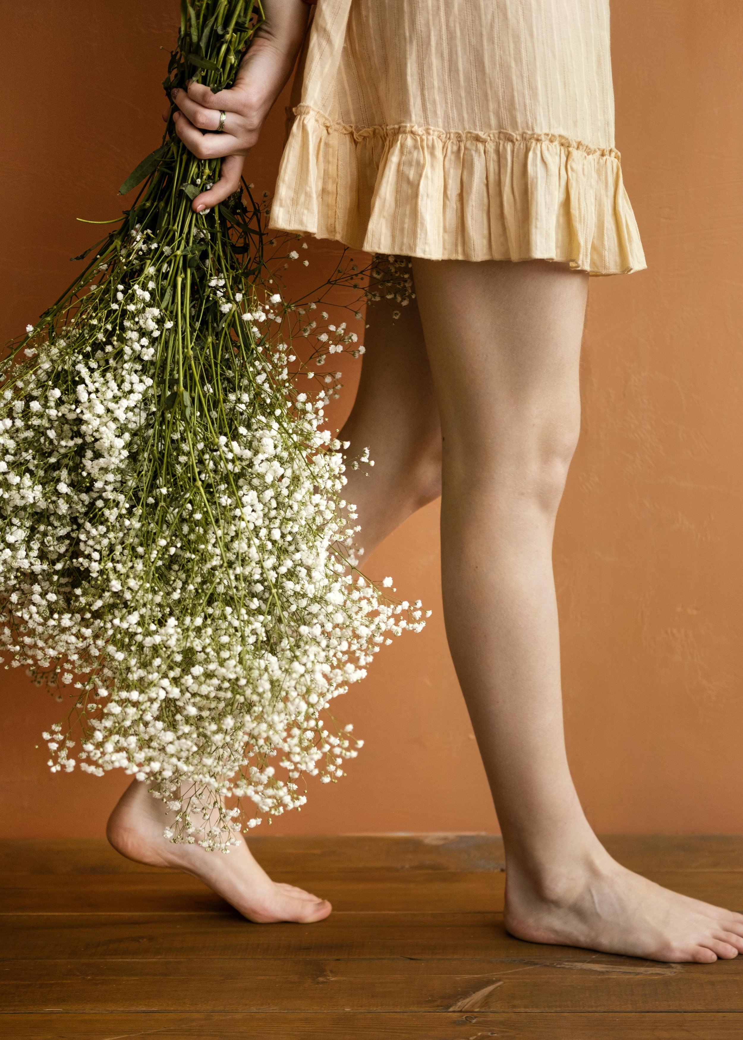 woman carrying bunch of baby's breath