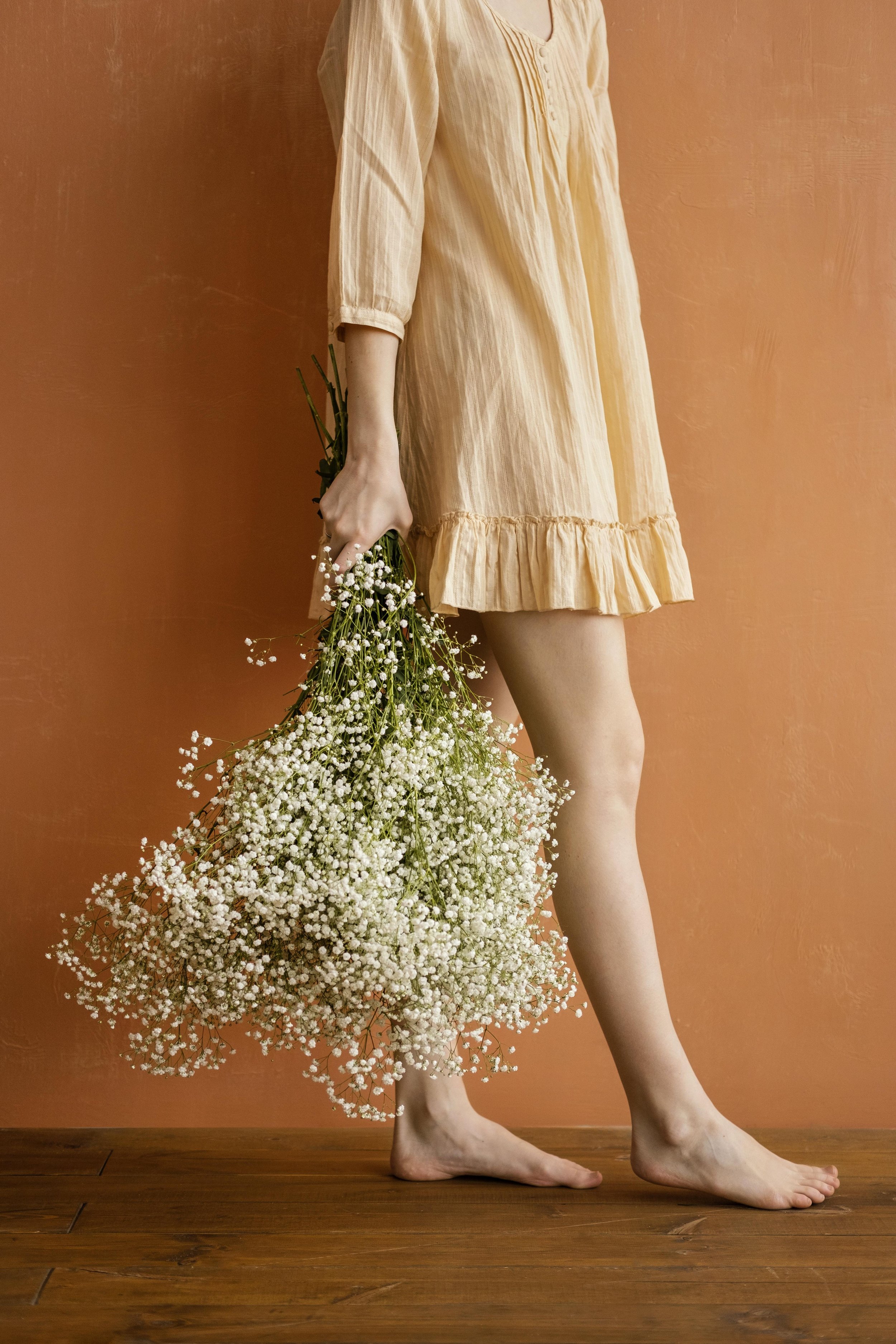 woman carrying bunch of baby's breath