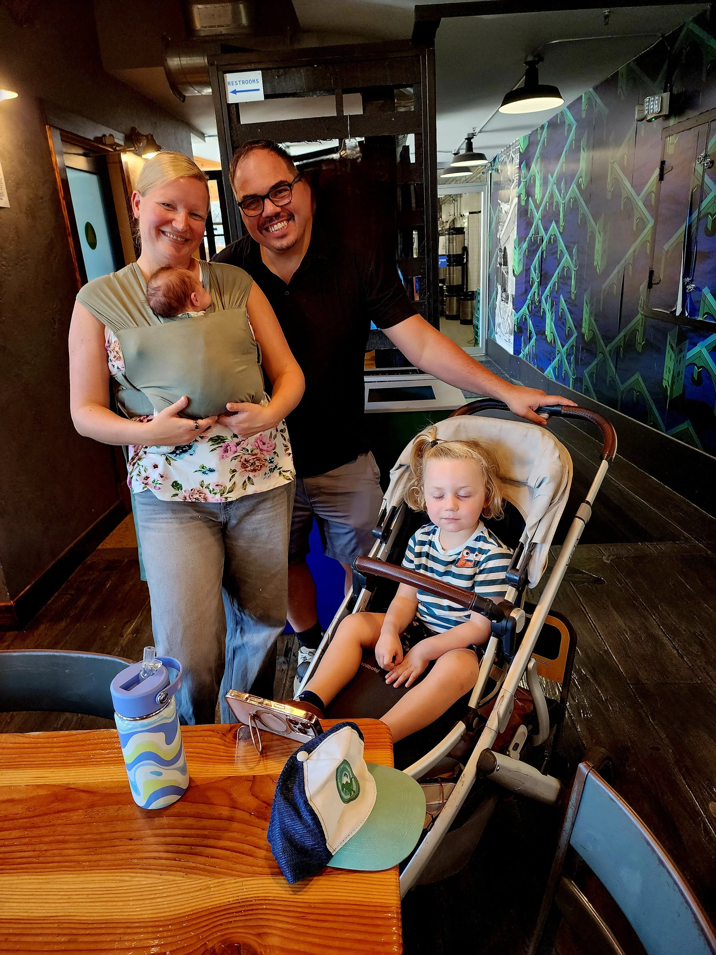 Young-Parents-with-three-year-old-and-new-born