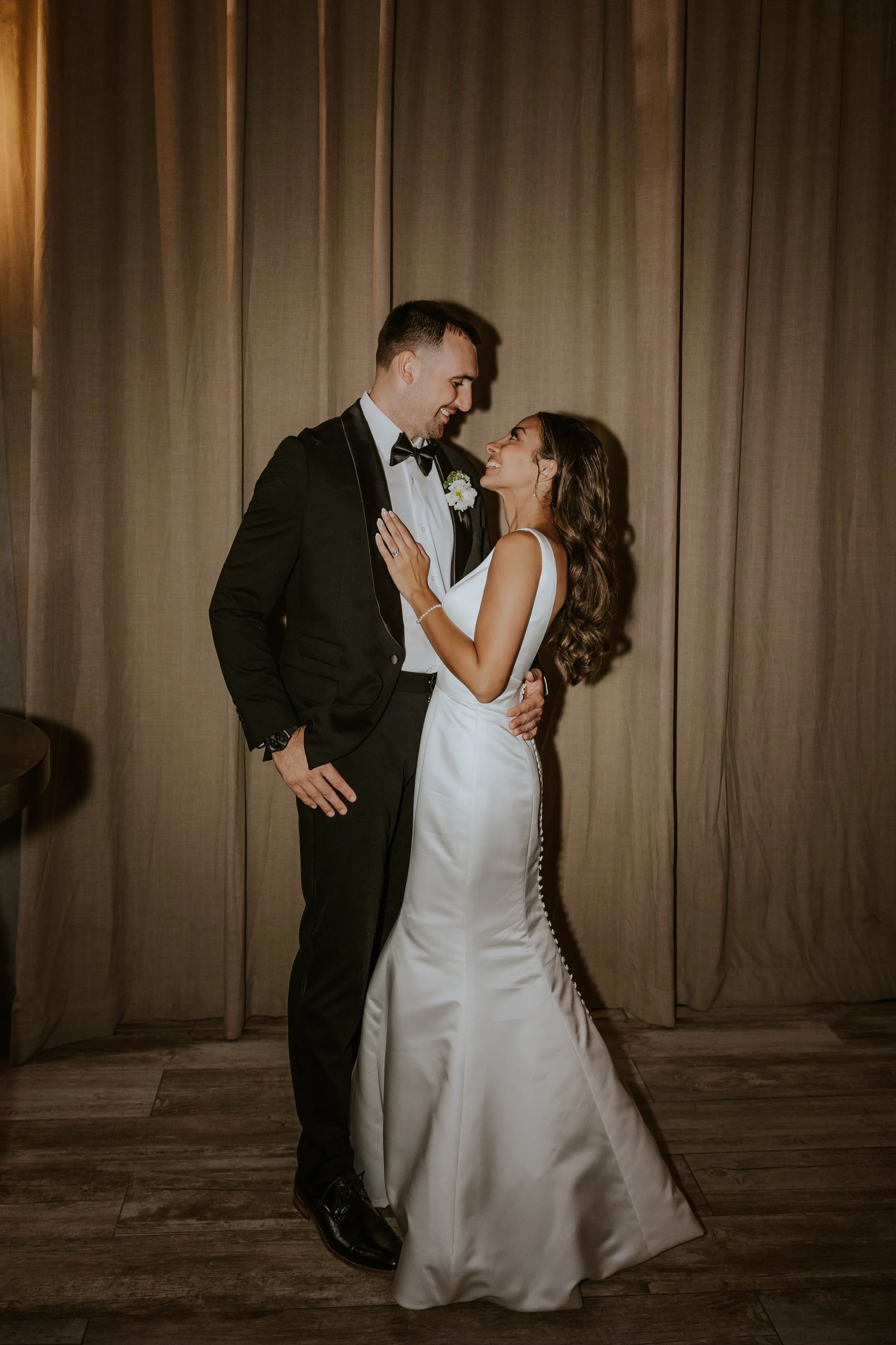 A bride and groom sharing a moment at The Barn at Villa Venezia