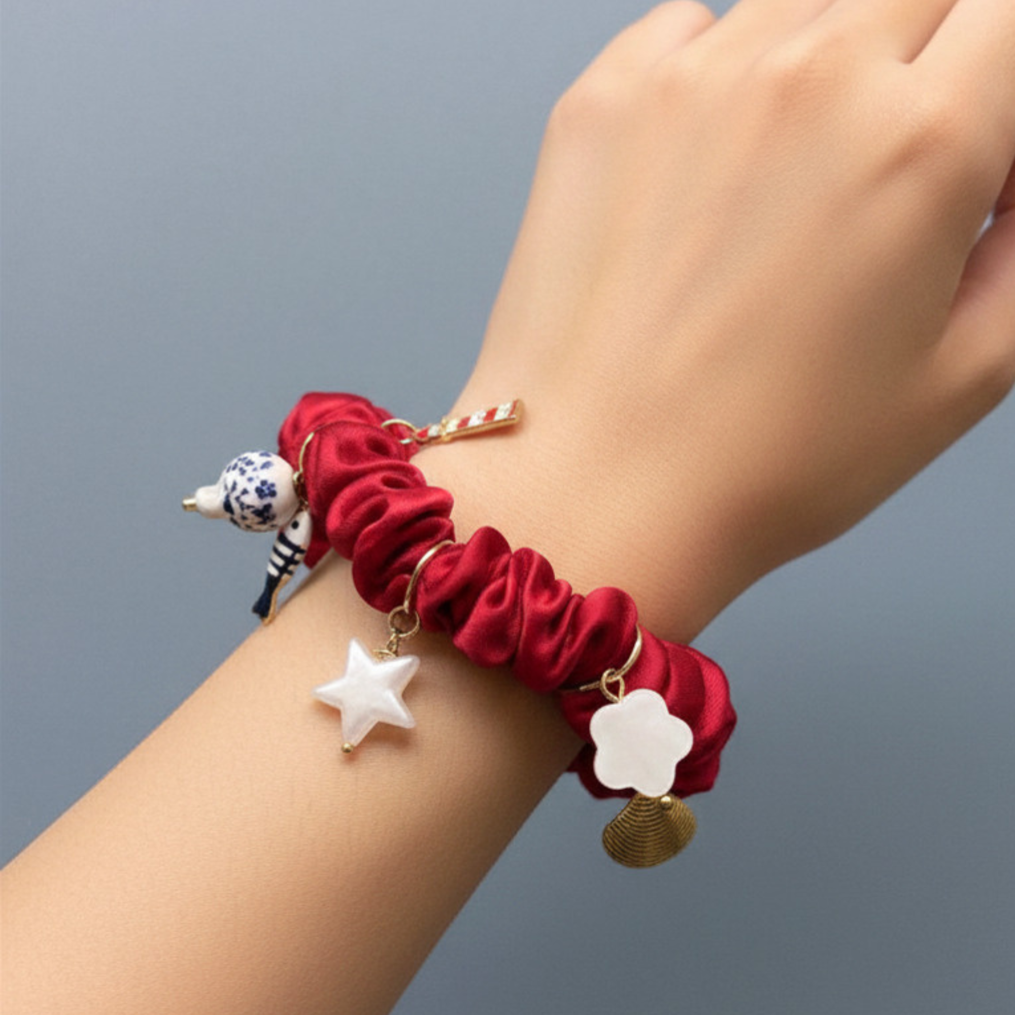 Madaket Charm Scrunchie- red on wrist.png