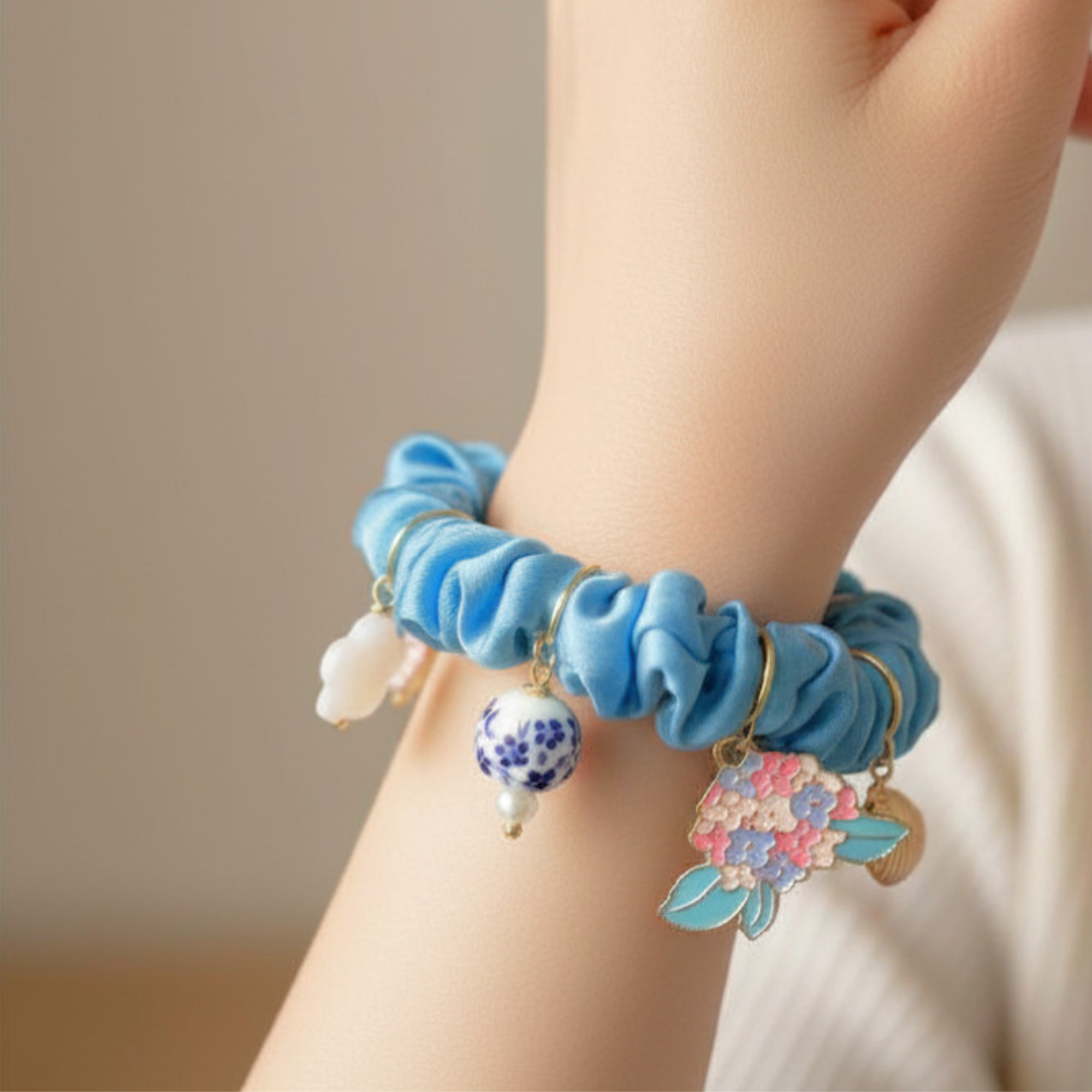 Madaket Charm Scrunchie- lt. blue on wrist.png