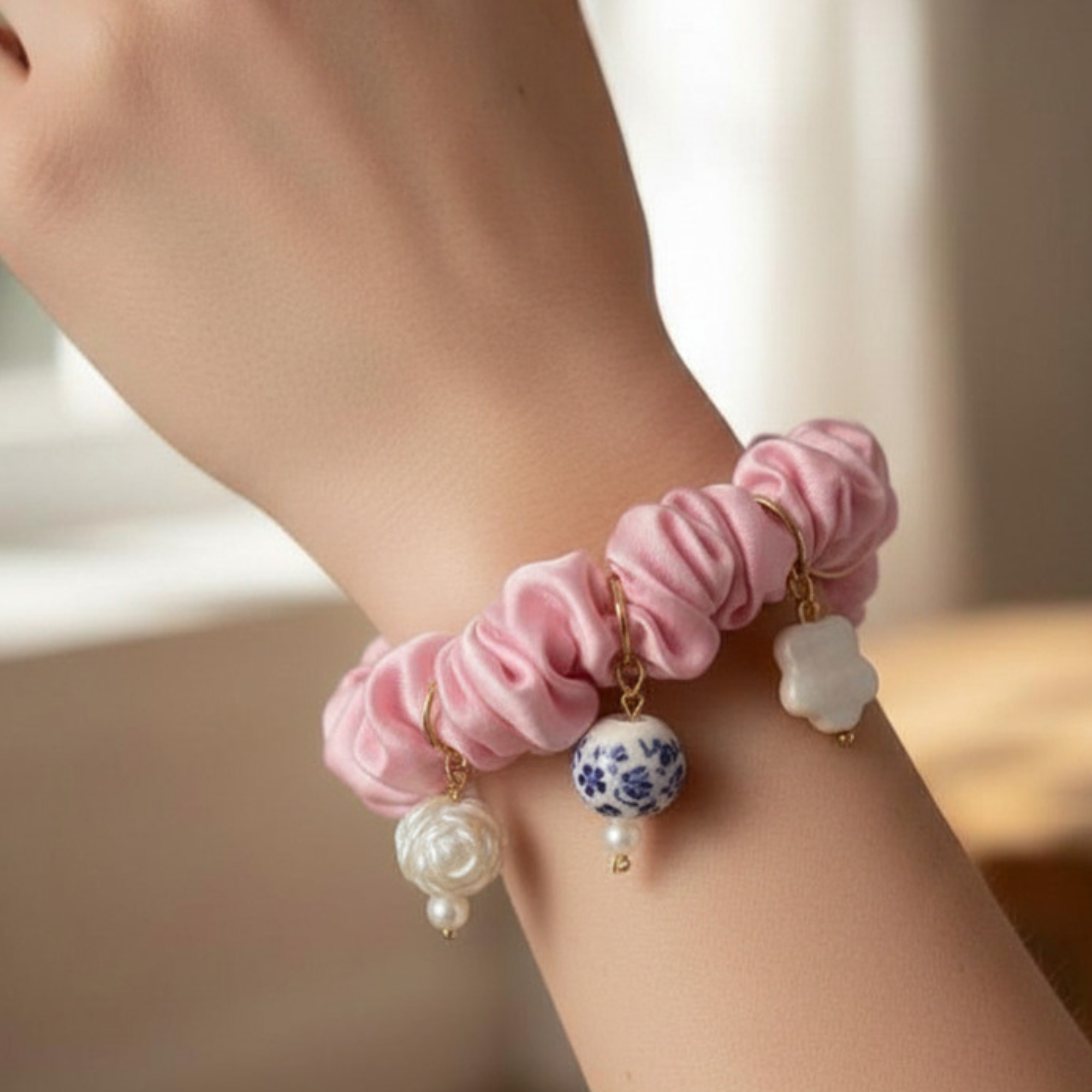 Madaket Charm Scrunchie- pink on wrist.png