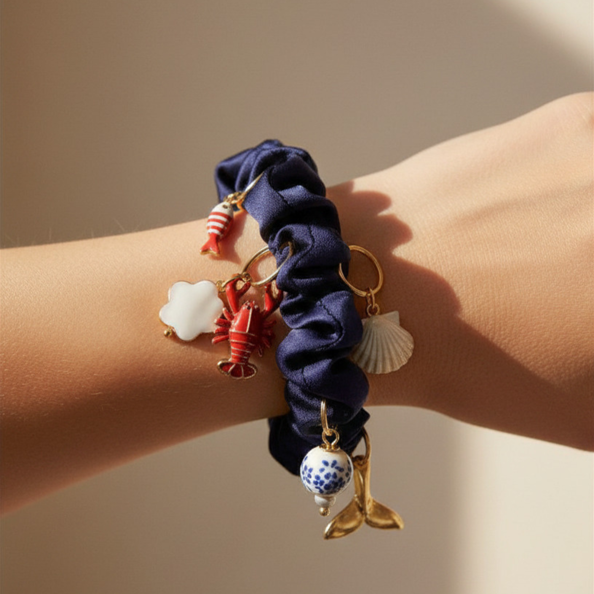 Madaket Charm Scrunchie- navy on wrist.png
