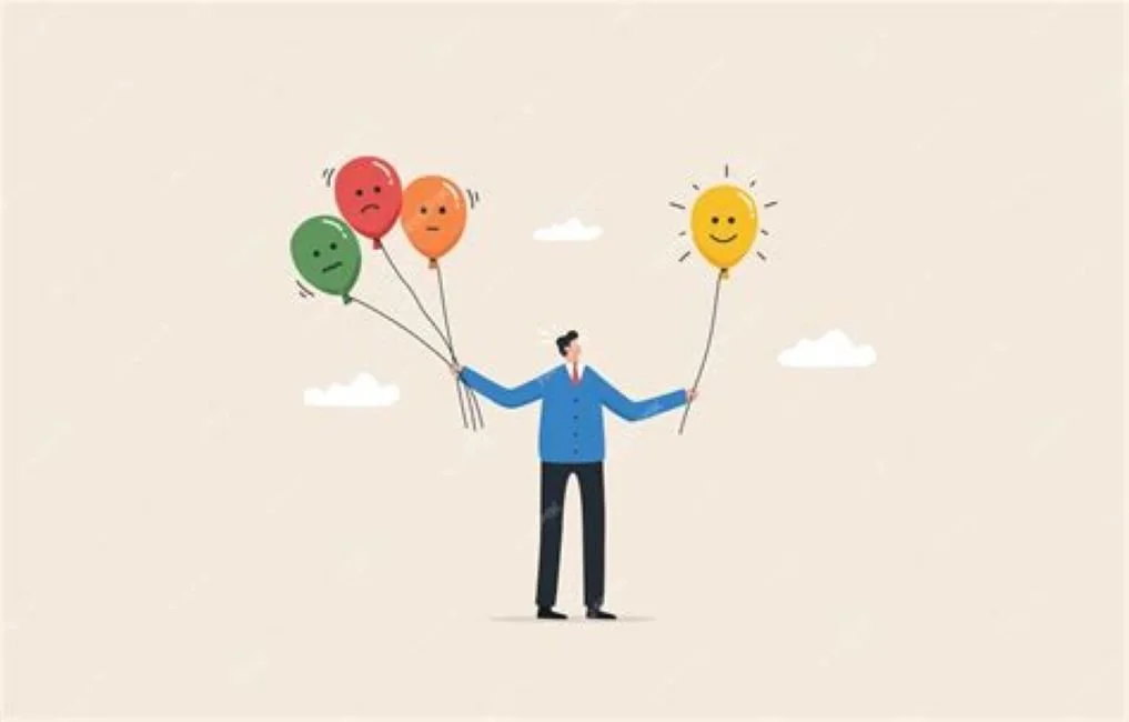 Personne tenant des ballons aux visages tristes et un ballon souriant