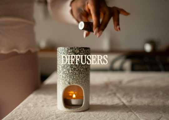 Person adding essential oil to a diffuser on a bedside table