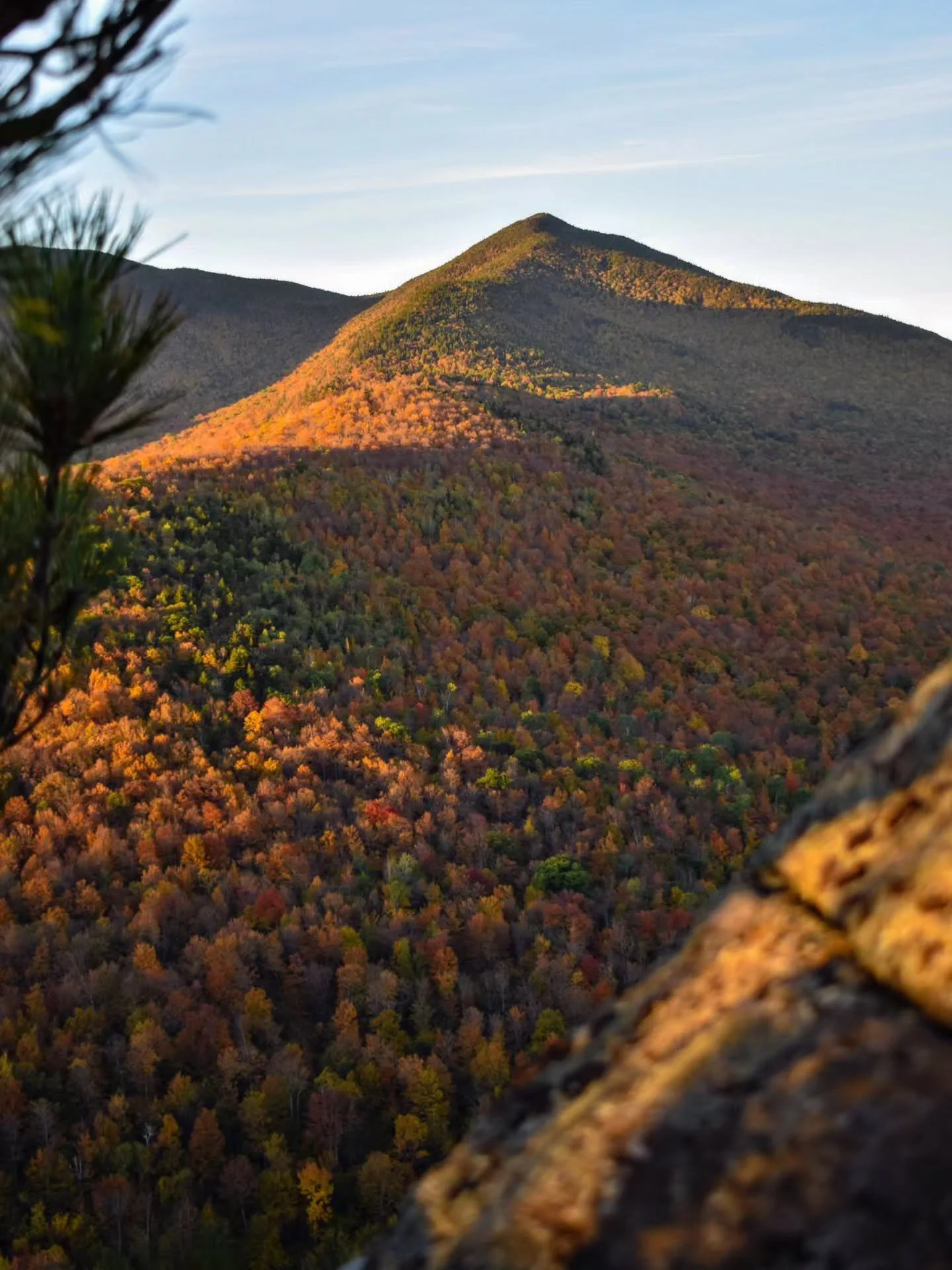 An Adirondack autumn view.
This spot is always a fall favorite. Lots of bright deciduous trees along the slopes to the south, opposed by Pitchoff to the north and its craggy, interspersed yellow- and red-leaved trees among the rocks.
Fall in the Ad