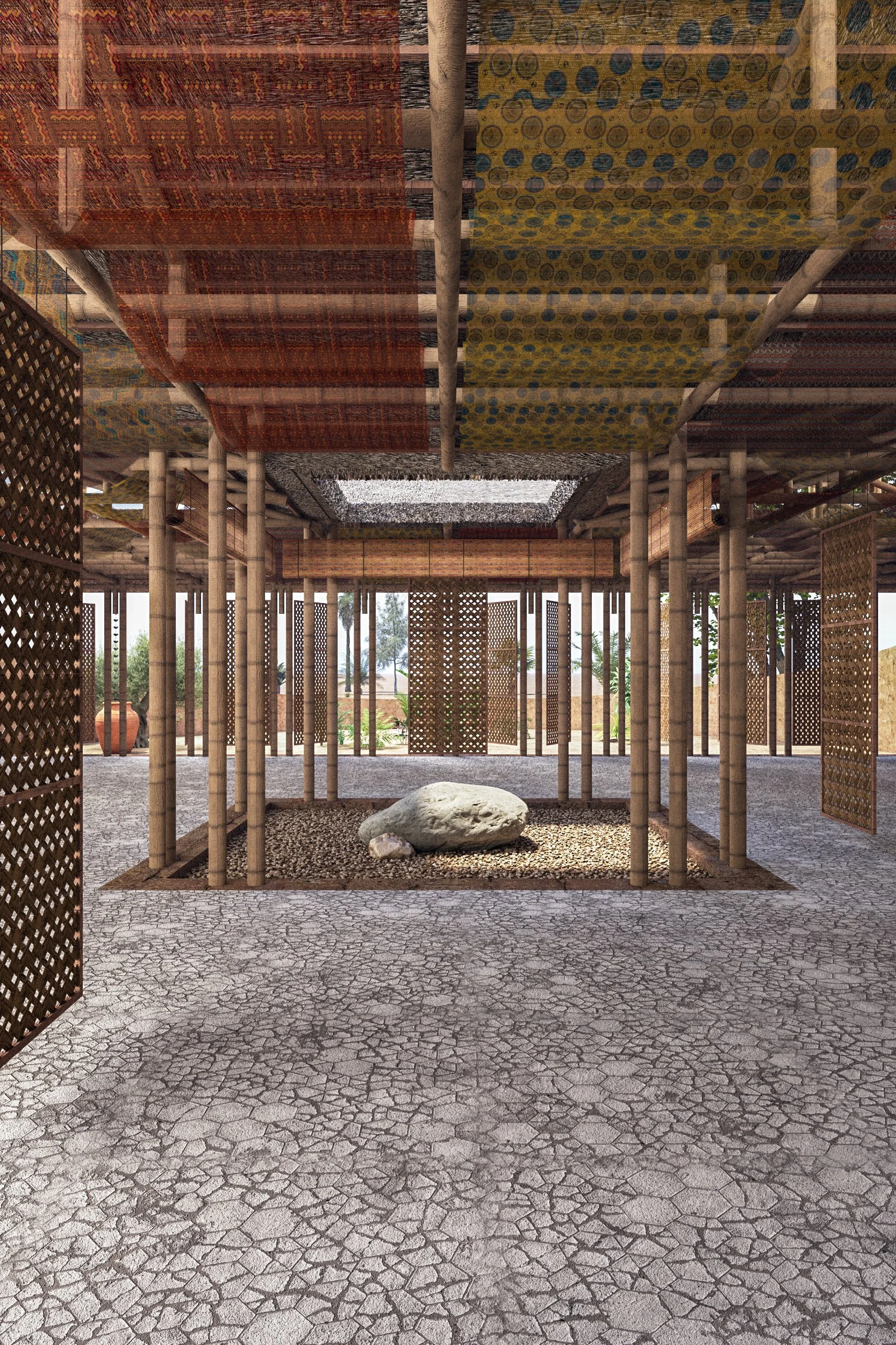 Interior of a structure featuring wooden posts and lattice walls, with colorful patterned fabric or mats on the ceiling, a large rock on a gravel patch, and an outdoor scene with palm trees in the background.