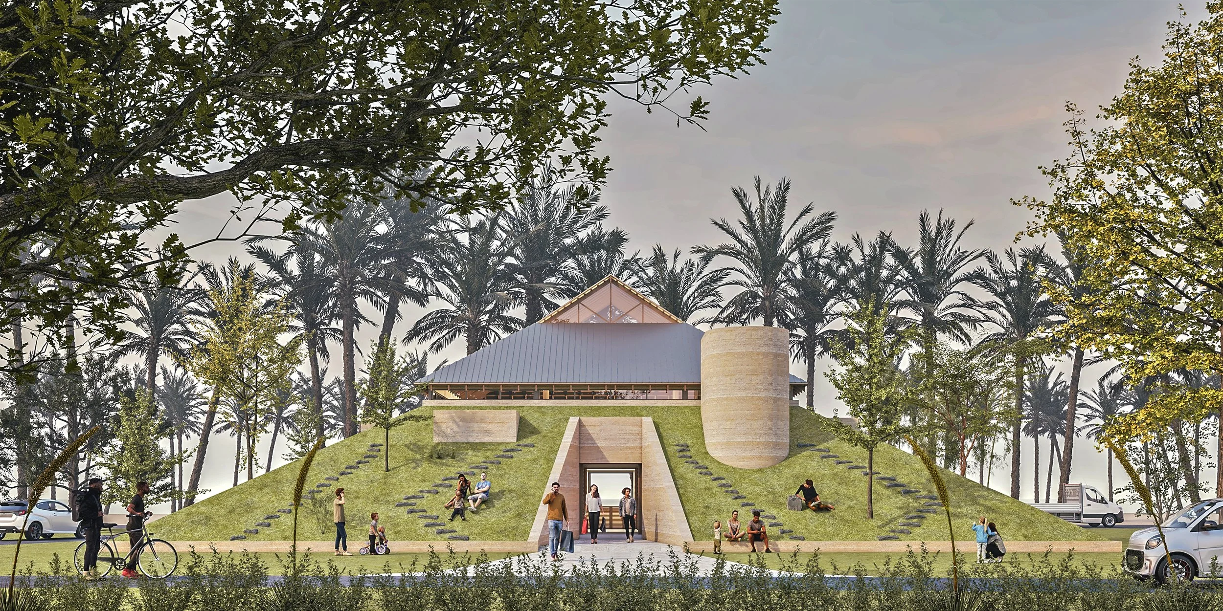 A modern building with a triangular roof on a grassy hill, surrounded by trees and palm trees, with people walking and sitting around, and cars parked nearby.