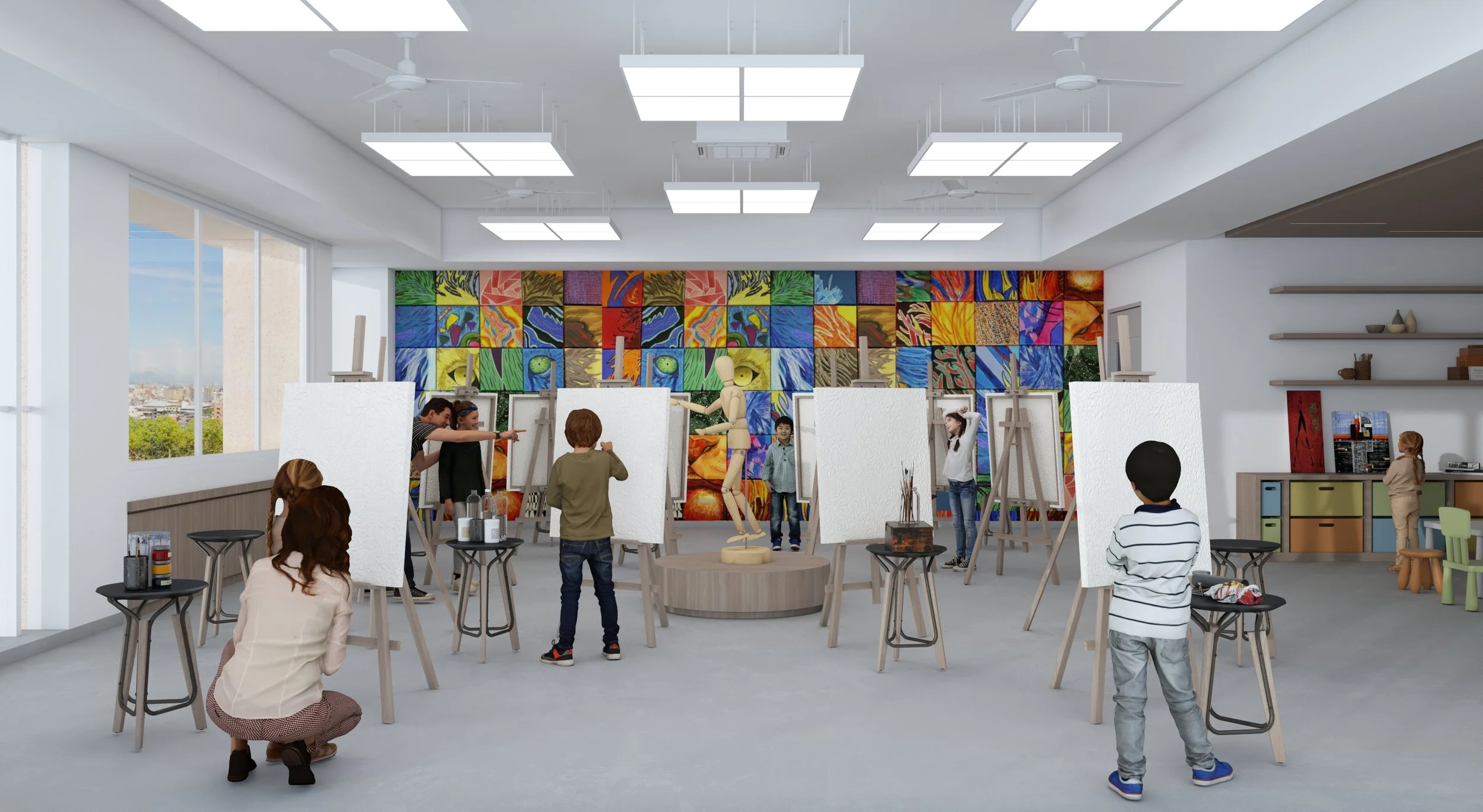Children and adults participating in a figure drawing class in an art studio with large sketch pads on easels, colorful artwork on the back wall, and windows providing natural light.