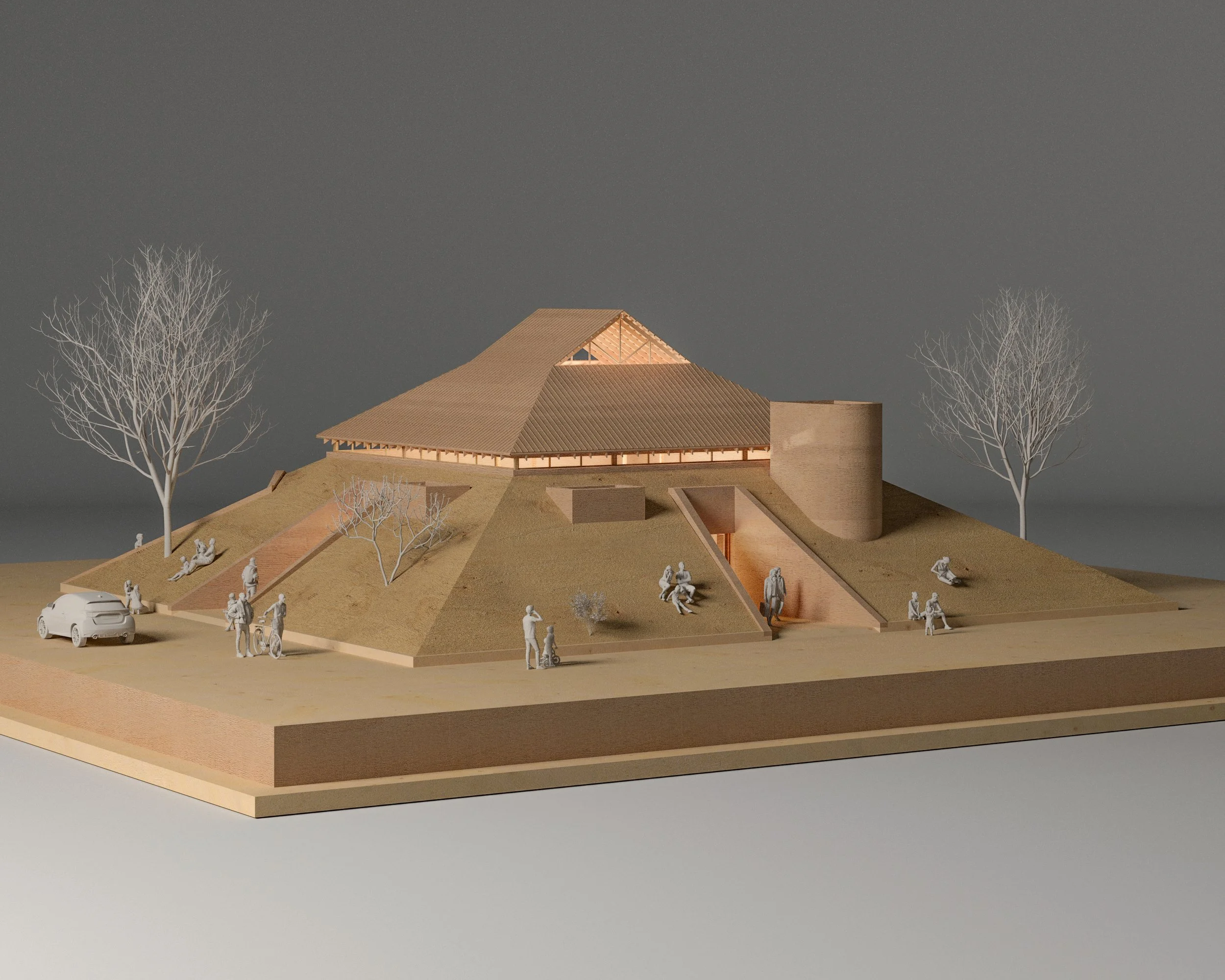 Architectural model of a modern building with sloped roofs, surrounded by barren trees and miniature people, set on a raised platform with a car nearby.