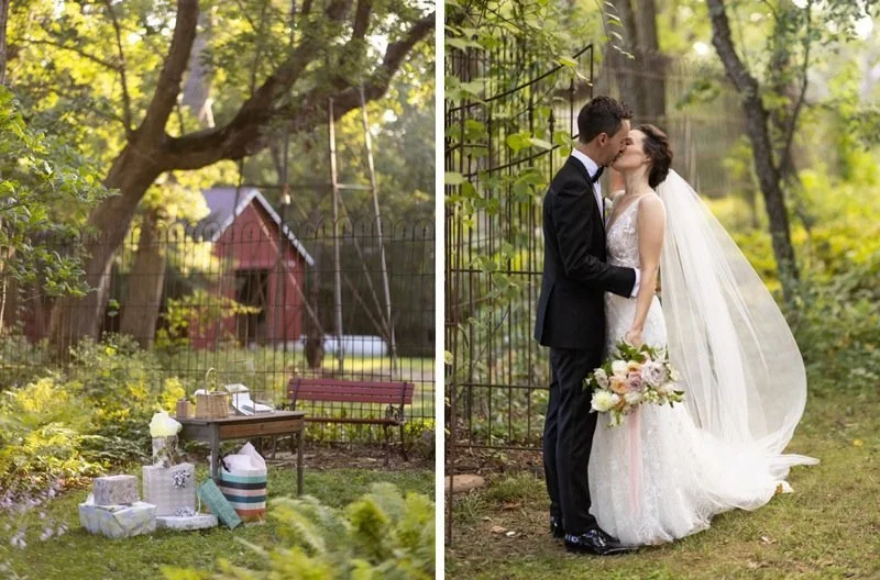 A romantic outdoor wedding scene with a bride and groom kissing, surrounded by green trees and a decorative fence.