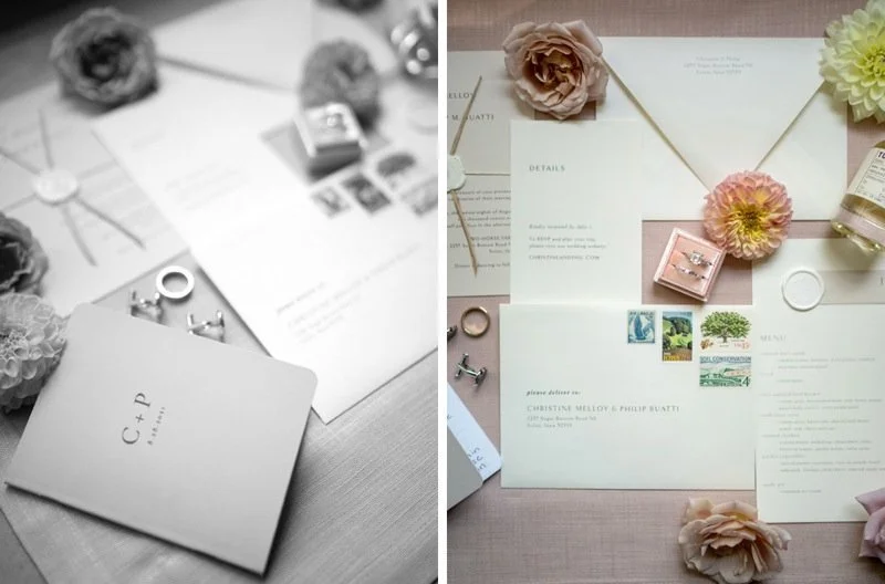 Wedding invitation and planning materials with flowers, rings, and stamps on a table.