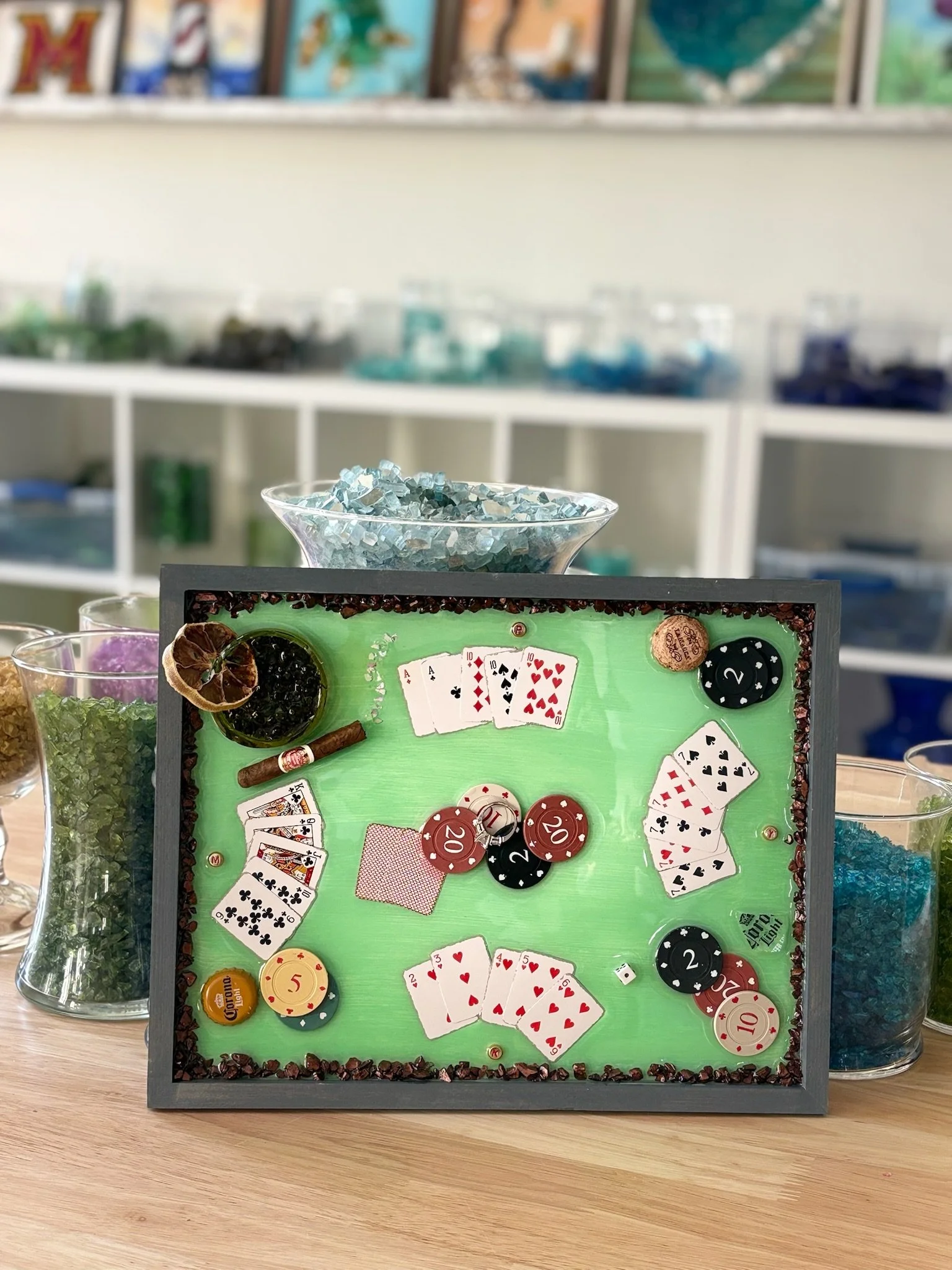 Resin Glass Art of poker table (with cards, poker chips, cigar, and drink using cut and crushed glass in a painted frame. Man Cave Art.