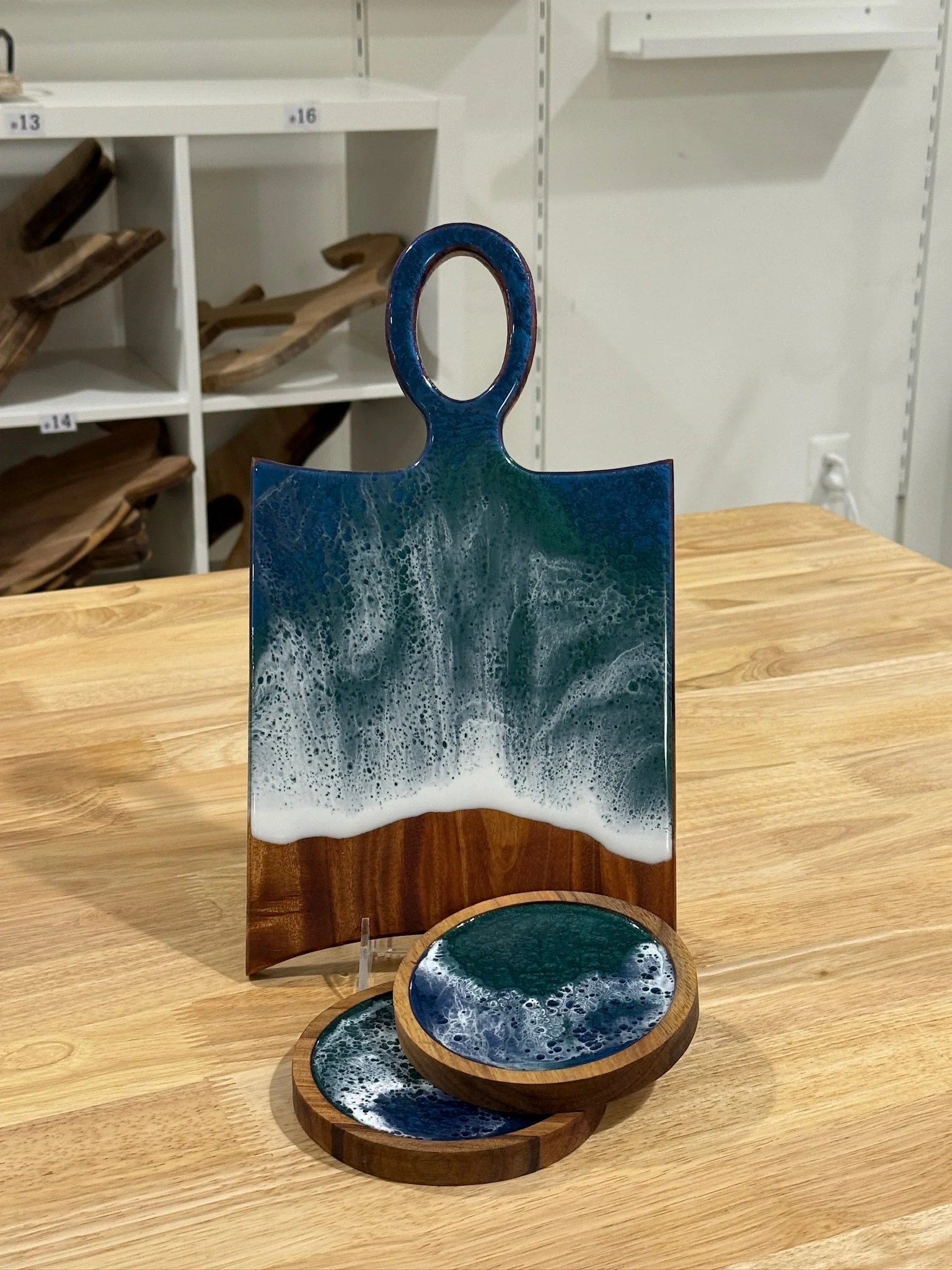 Wooden charcuterie board with resin ocean wave poured on it. Accompanied with a matching wooden coaster and bowl.
