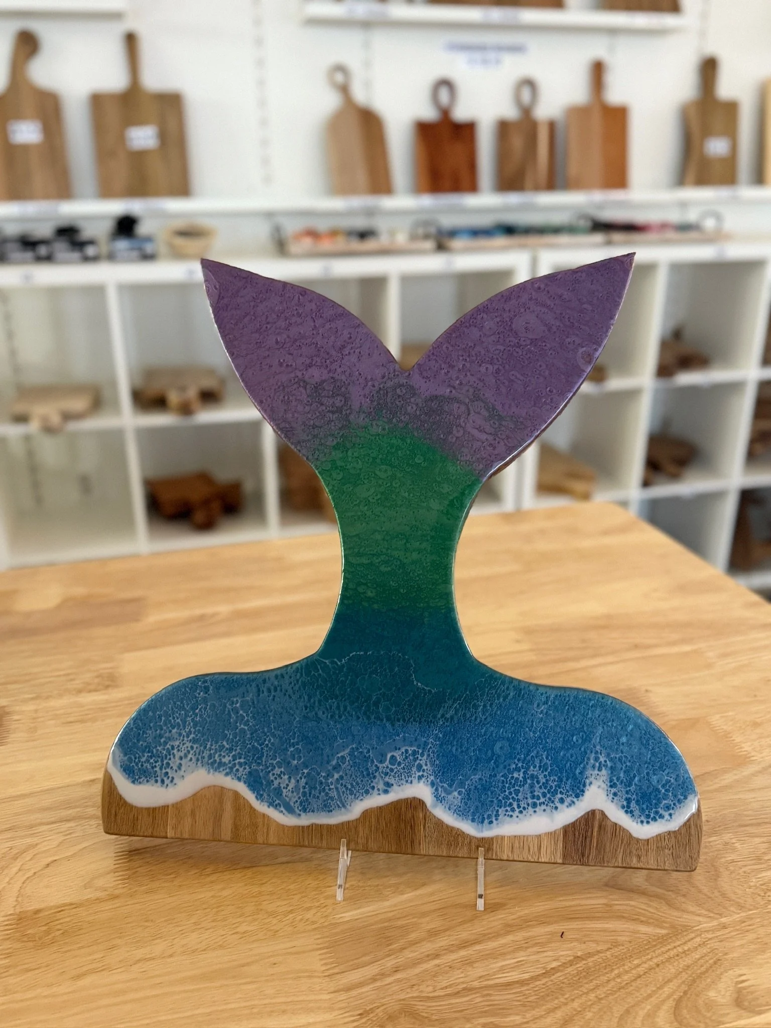 Whale (Mermaid) shaped wooden charcuterie board with resin ocean wave poured on it. 