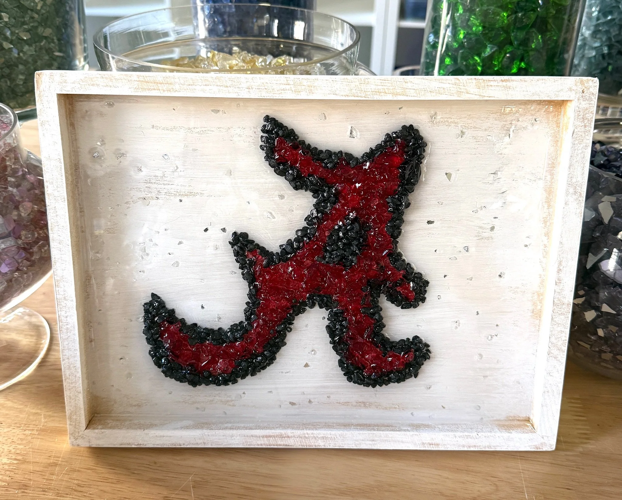 Resin Glass Art of the University of Alabama "A" using cut and crushed glass in a painted frame.