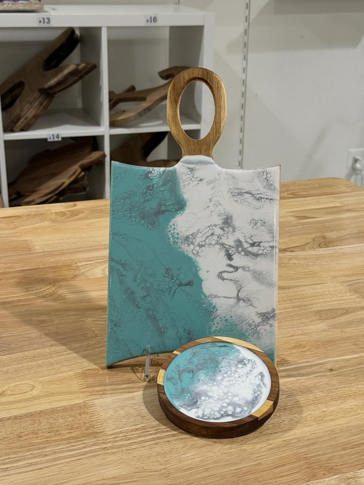 Wooden charcuterie board with resin ocean wave poured on it. Accompanied wit a matching wooden coaster.