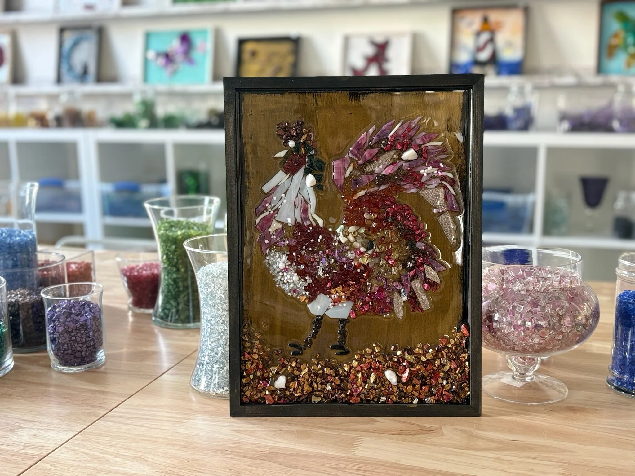 Resin Glass Art of a rooster using cut and crushed glass in a painted frame.