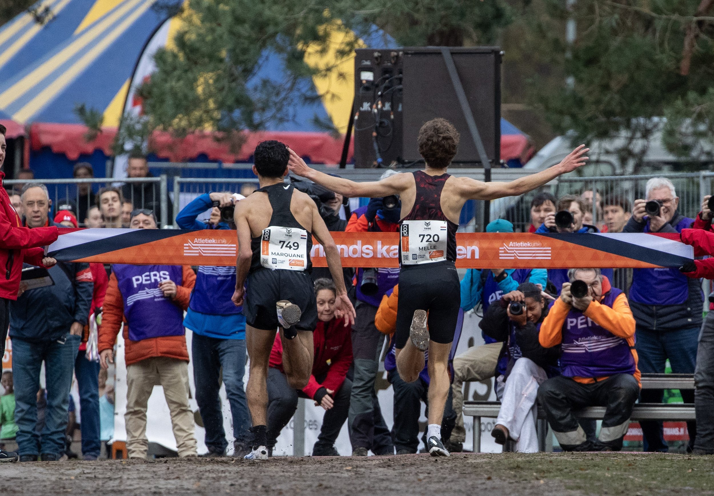 Track athletes at the Finishing line, viewed from the back
