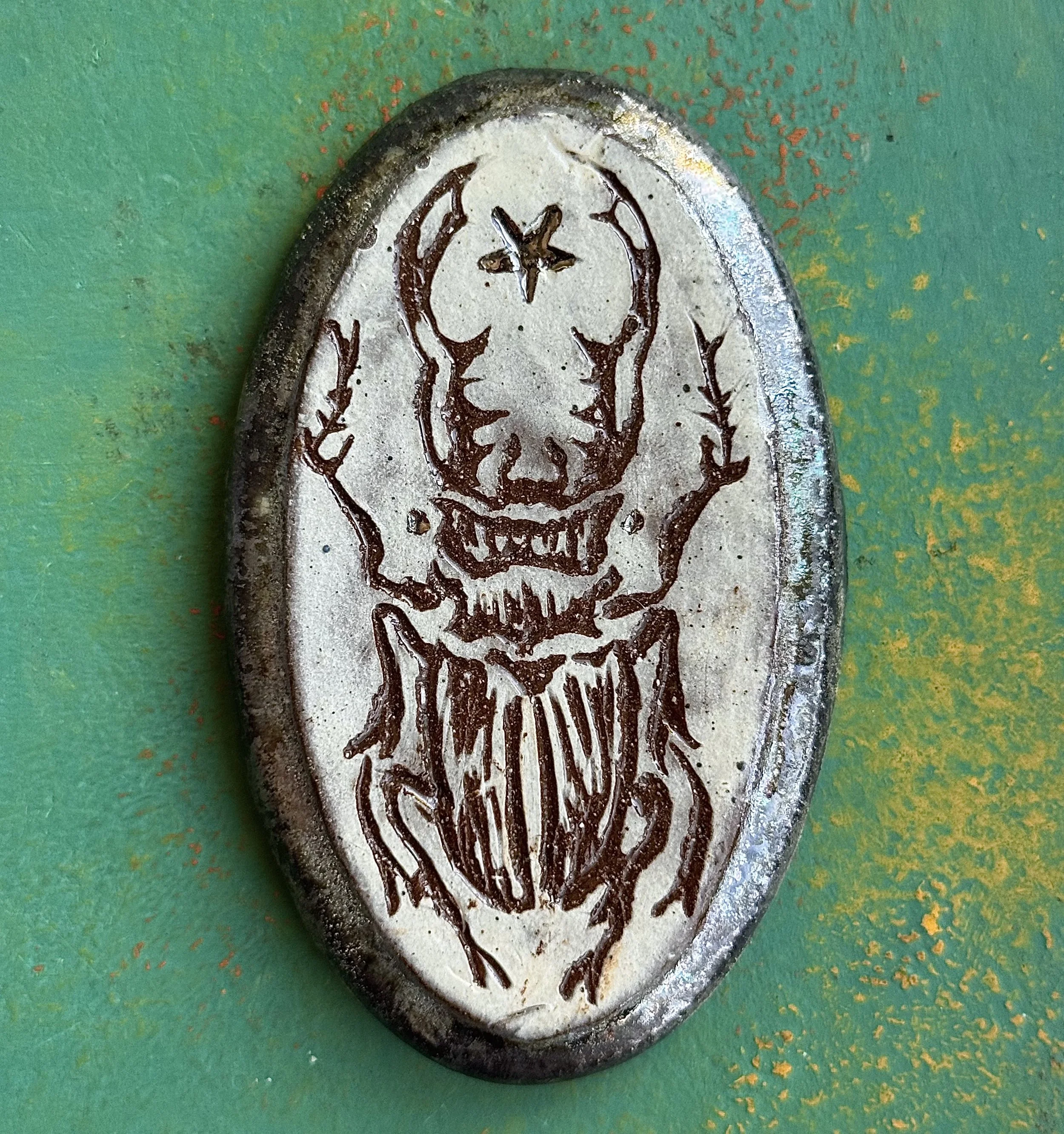 "LUCANIDAE", red earth ceramic wall hanging, engobe