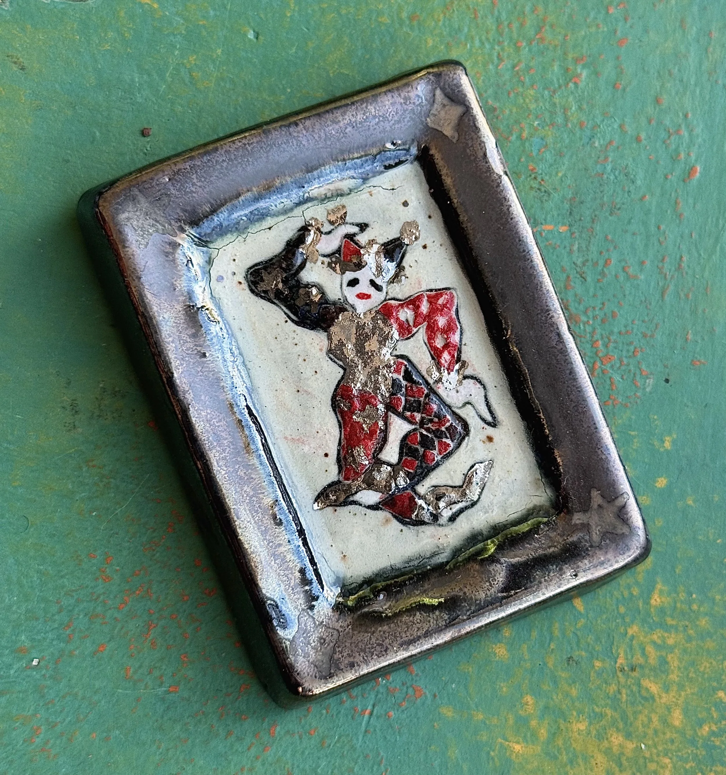 "TRIVIAL JOY!", red earth ceramic wall hanging, engobe