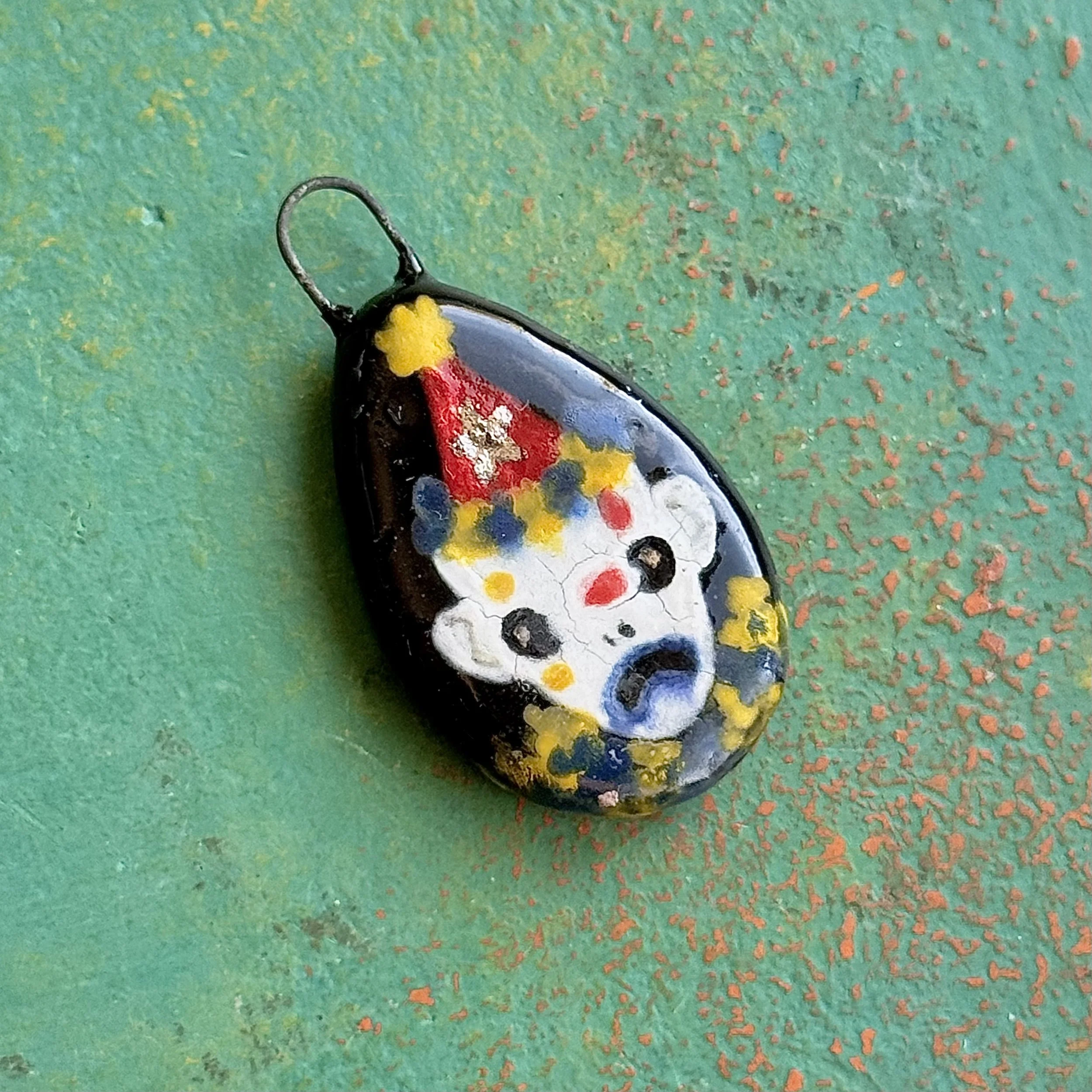 "TOUGH TO BE A FOOL", red earth ceramic pendant, velvet underglaze, white gold lustre