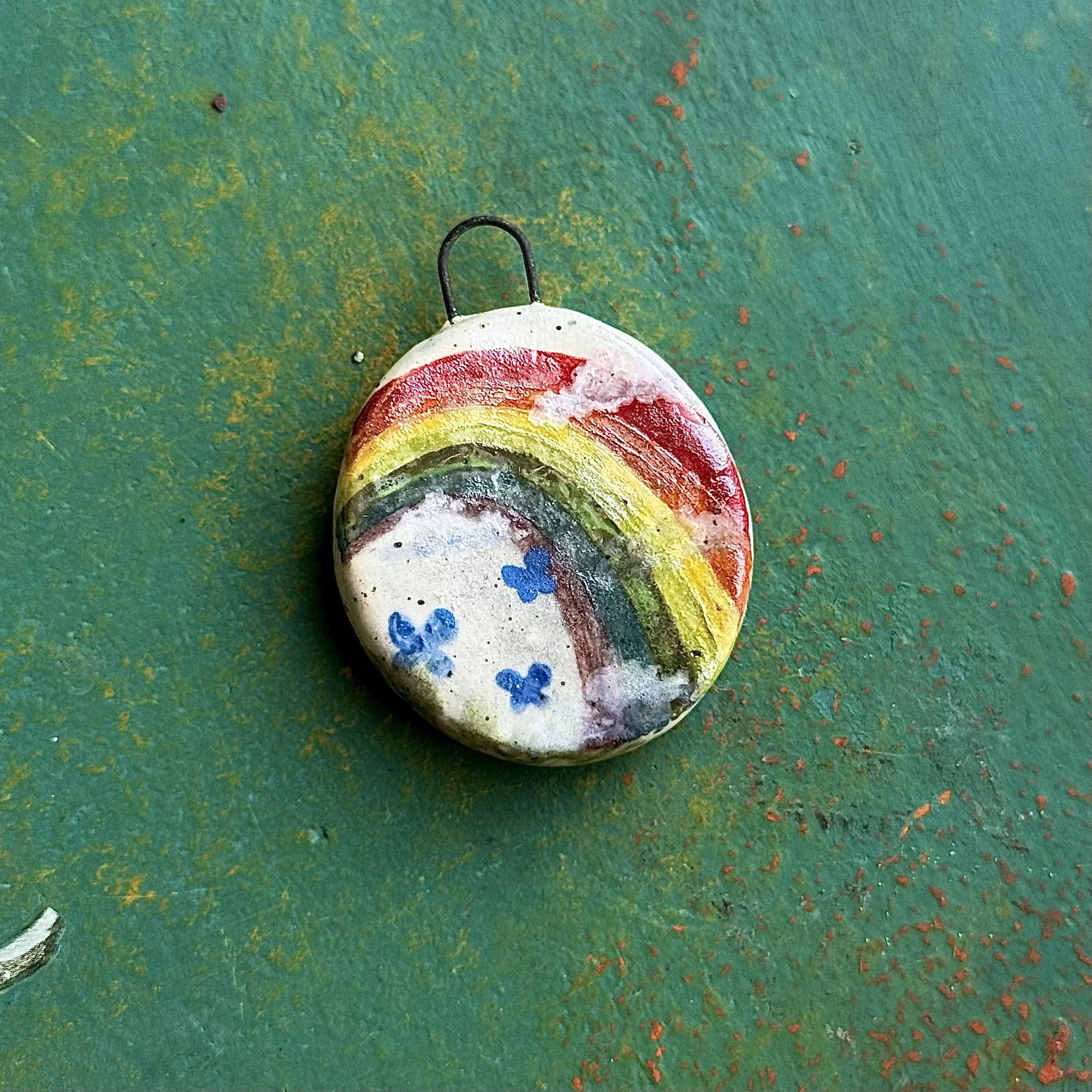 "LATE SUMMER HARVEST" (back), red earth ceramic pendant, velvet underglaze, mother of pearl lustre