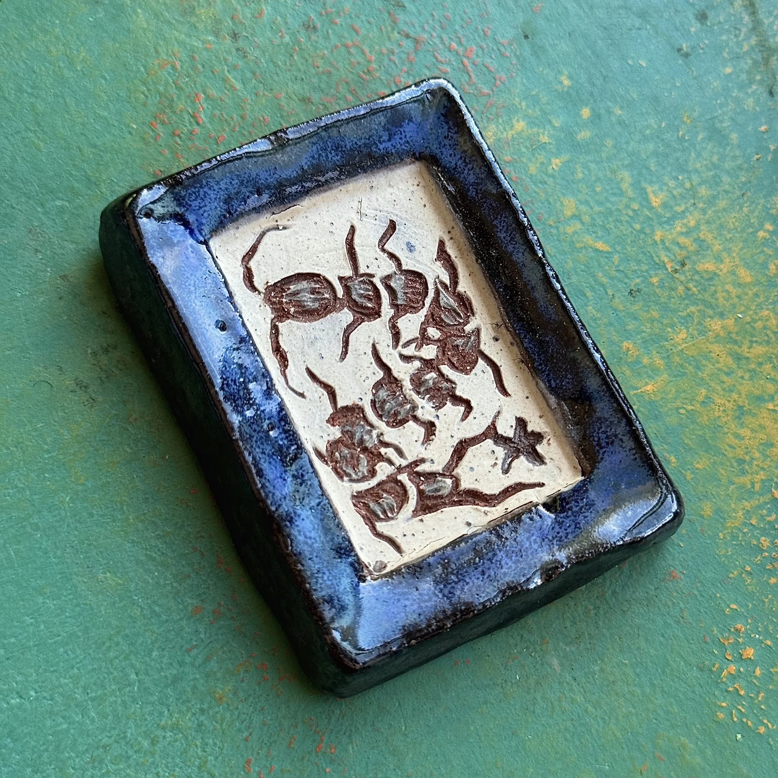 "HOUSE CENTIPEDE TRIBUTARY", red earth ceramic wall hanging, engobe