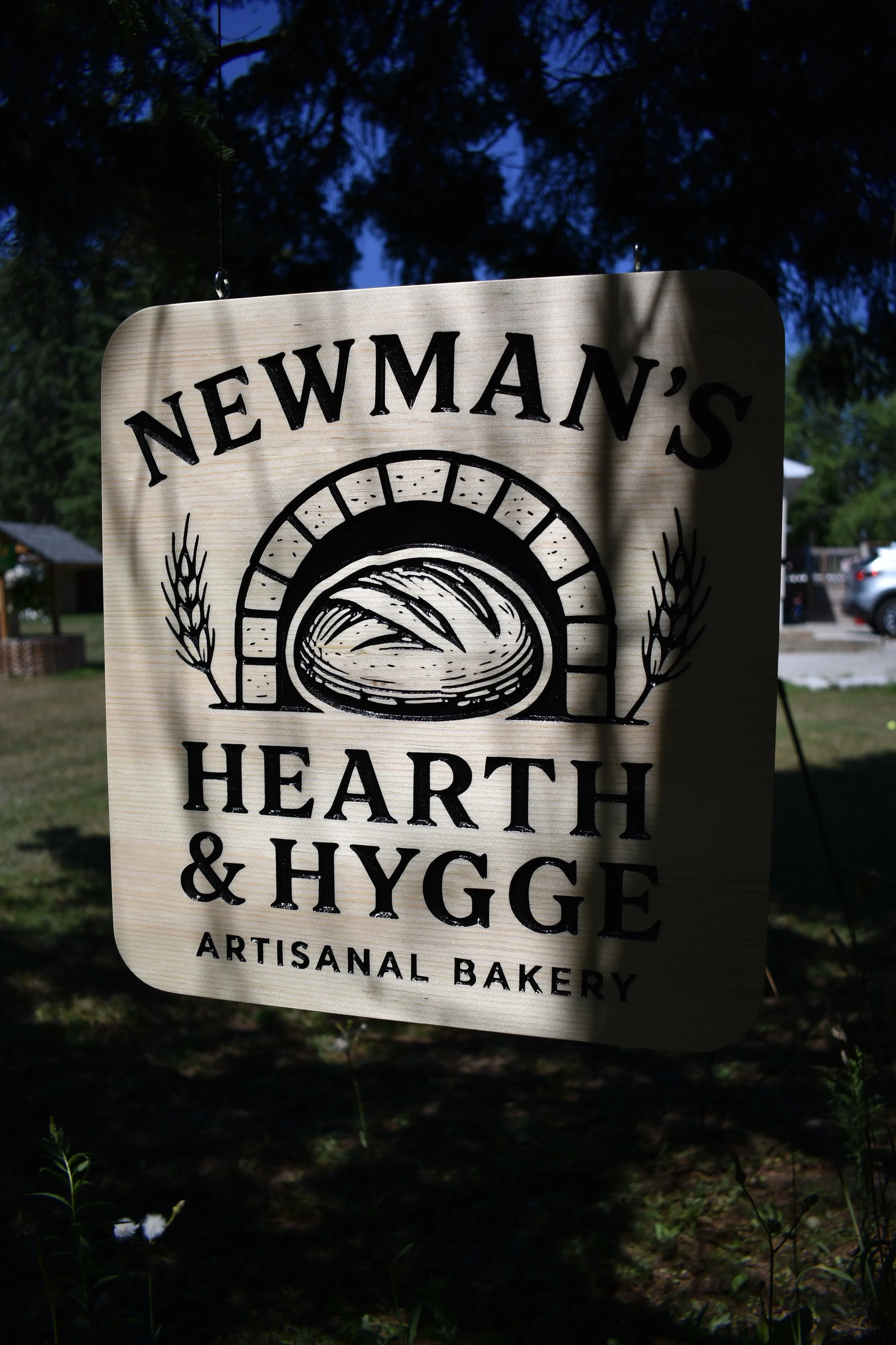 Engraved, painted, double-sided hanging sign