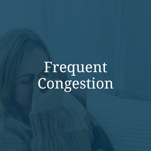 A woman holding her forehead with her hand, appearing to have a headache or illness, overlaid with the text 'Frequent Congestion' on a blue background.