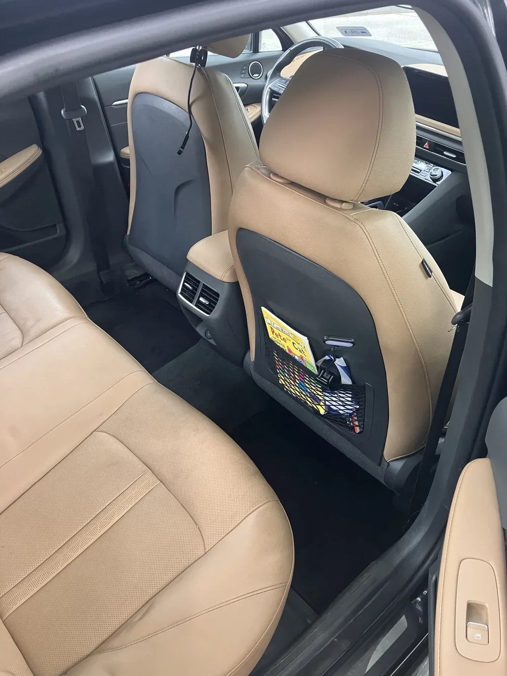 Tan leather interior spotless after deep cleaning by DMV Driveway Detailing in DC