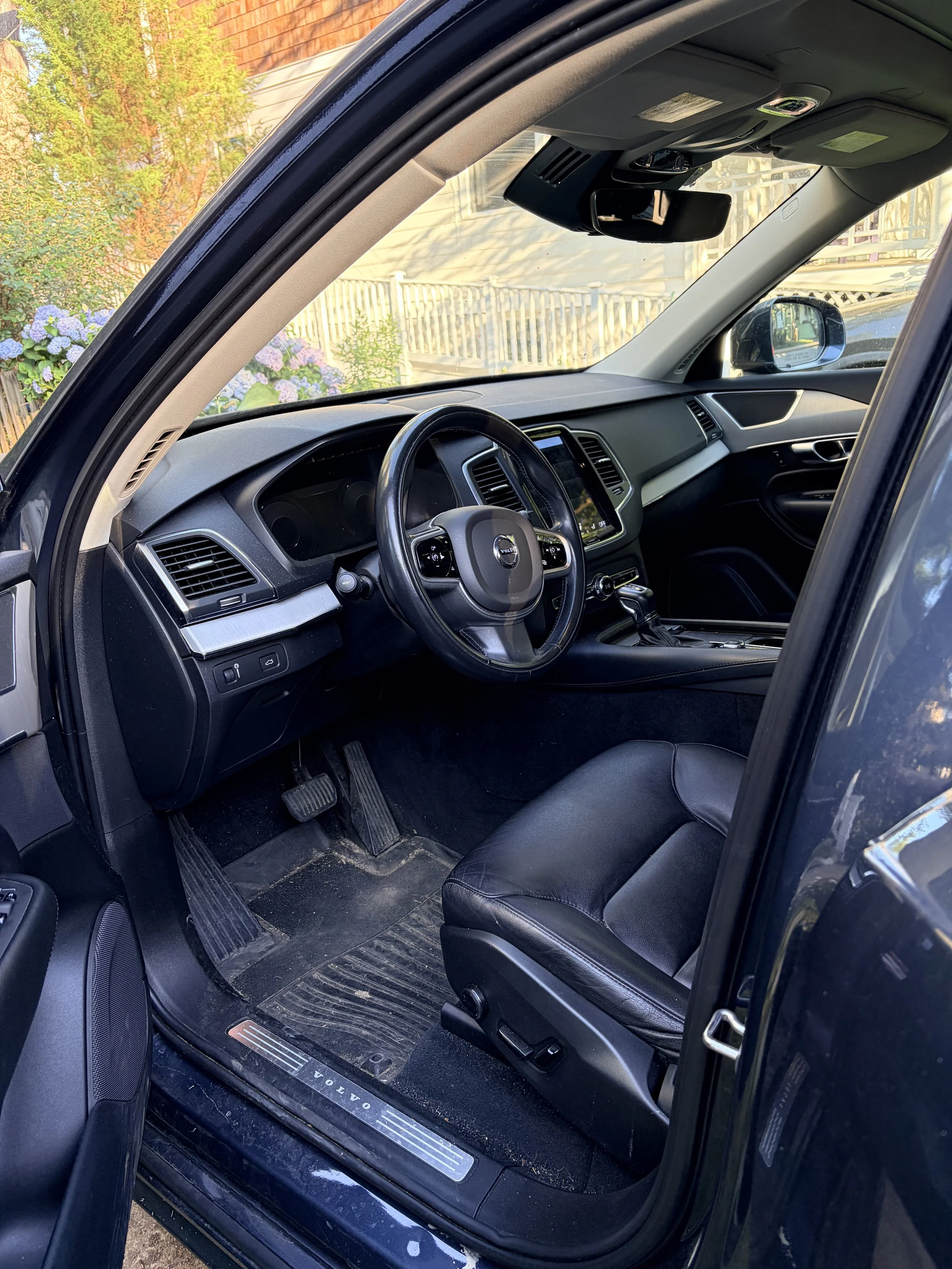 Dusty dashboard and front interior before detailing in Arlington VA