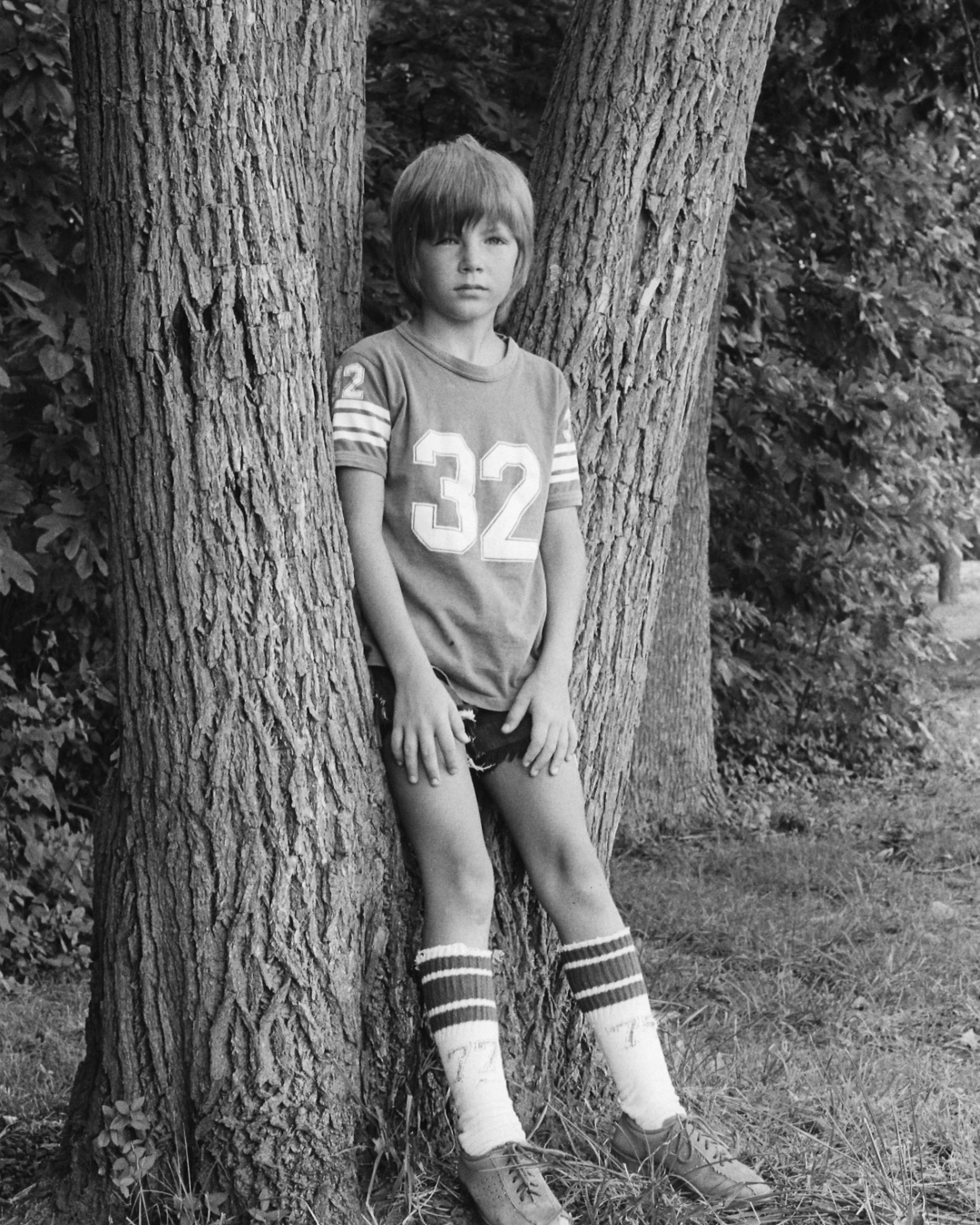 8-year-old Gary leaning against a tree at Old Hickory Lake in 1975. 