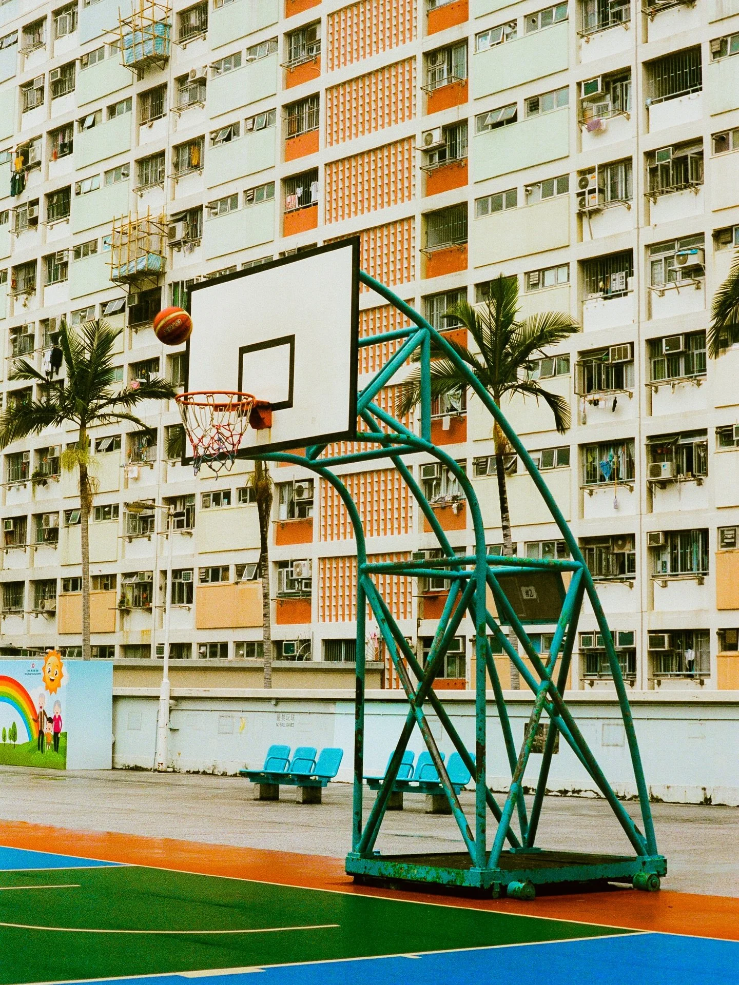 There&rsquo;s probably hundreds of thousands of pictures of that very same hoop on this app and in people&rsquo;s SDs and hard drives BUT:

It was a father and son duo shooting that ball, it had just started raining on the hot tarmac, I had just had 