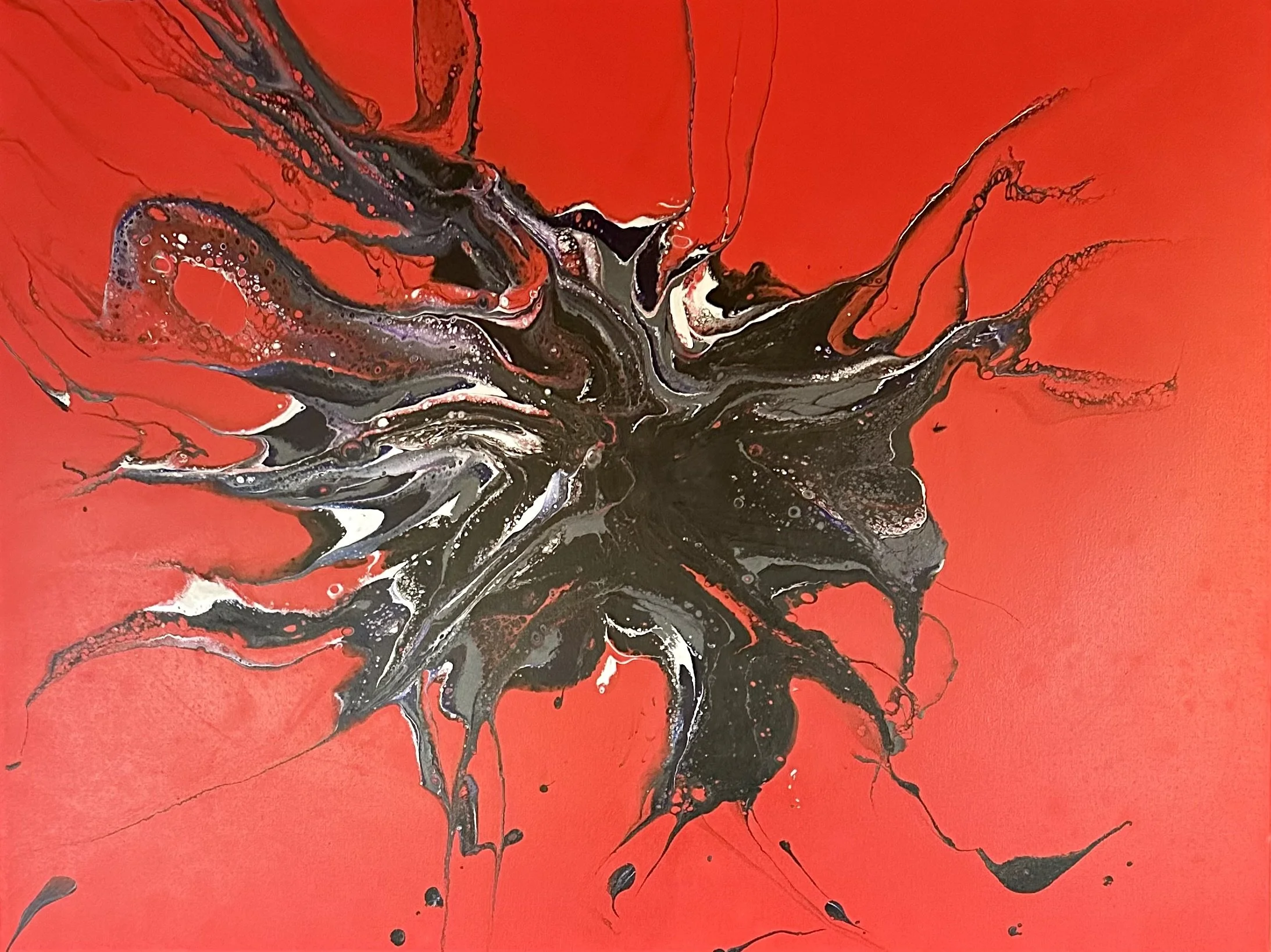 Red painting with a black, purple and silver sprawl coming out from the middle.